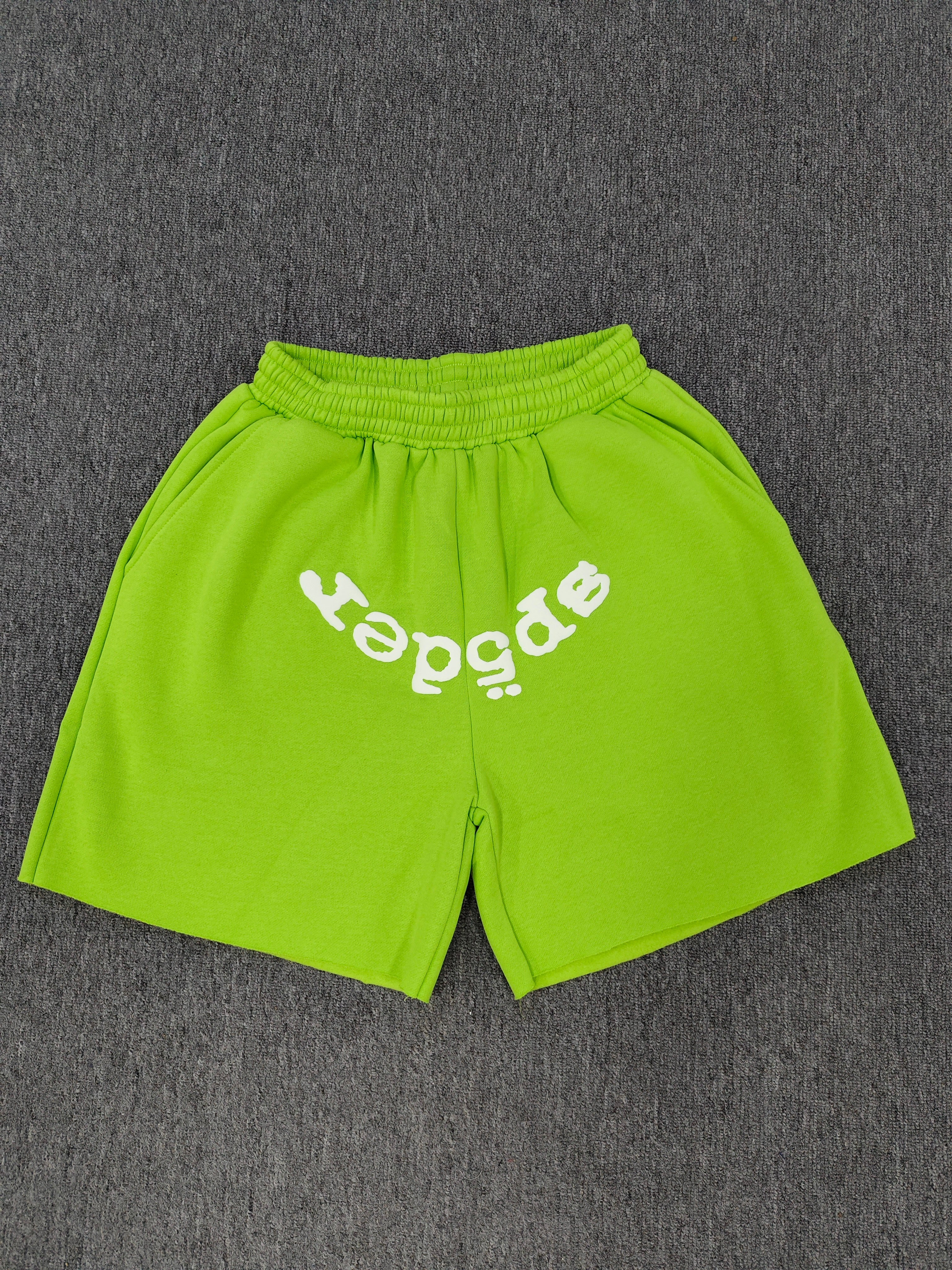 neon green Sp5der OG Web V2 sweatshorts feature a white logo print across the front