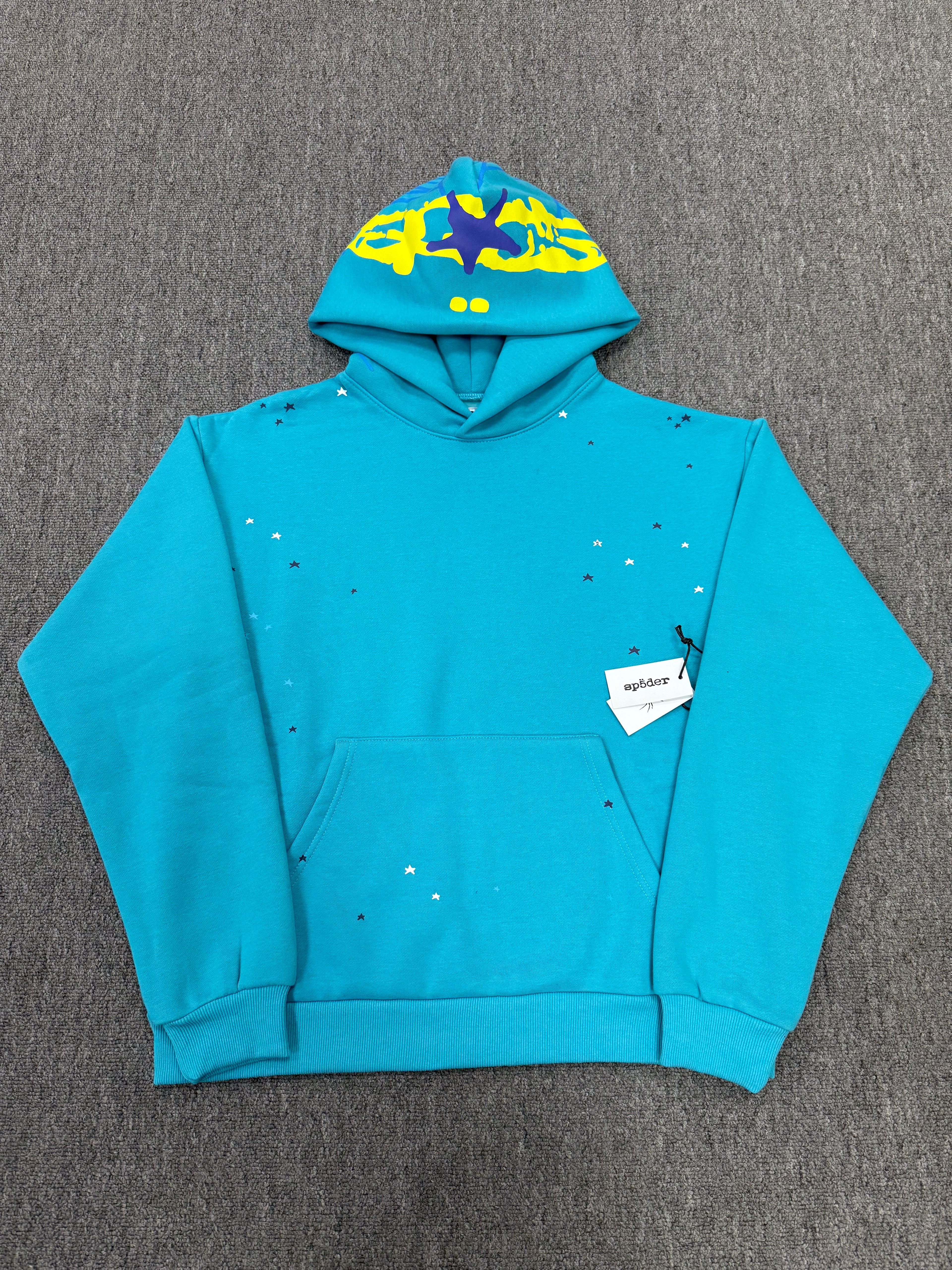 Sp5der Heavy Web Hoodie in 'Cyan' is designed with a striking blue color and a signature web-inspired graphic on the hood