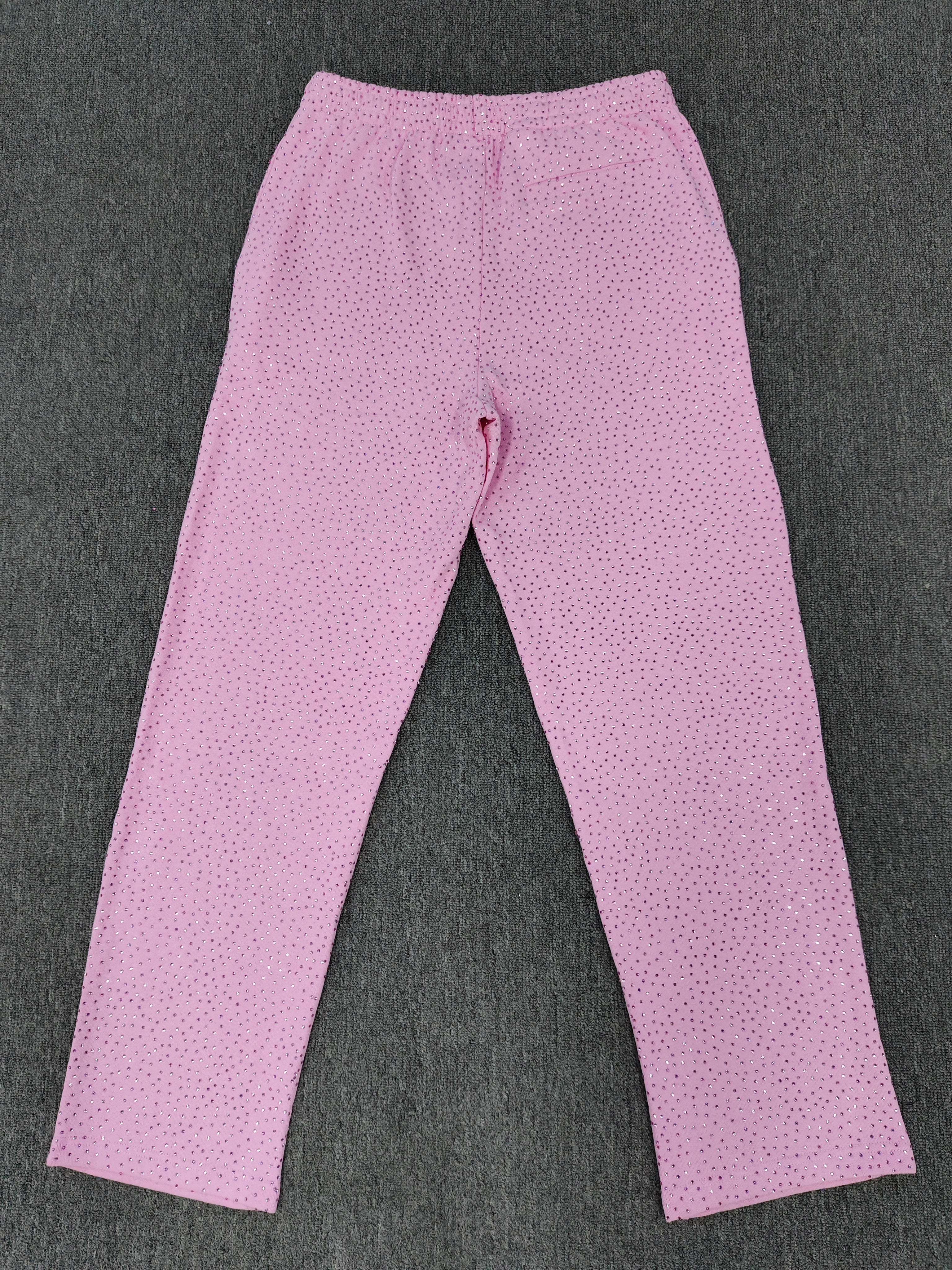 pink Sp5der sweatpants feature an all-over tonal rhinestone application and a SP5DER logo printed across the crotch