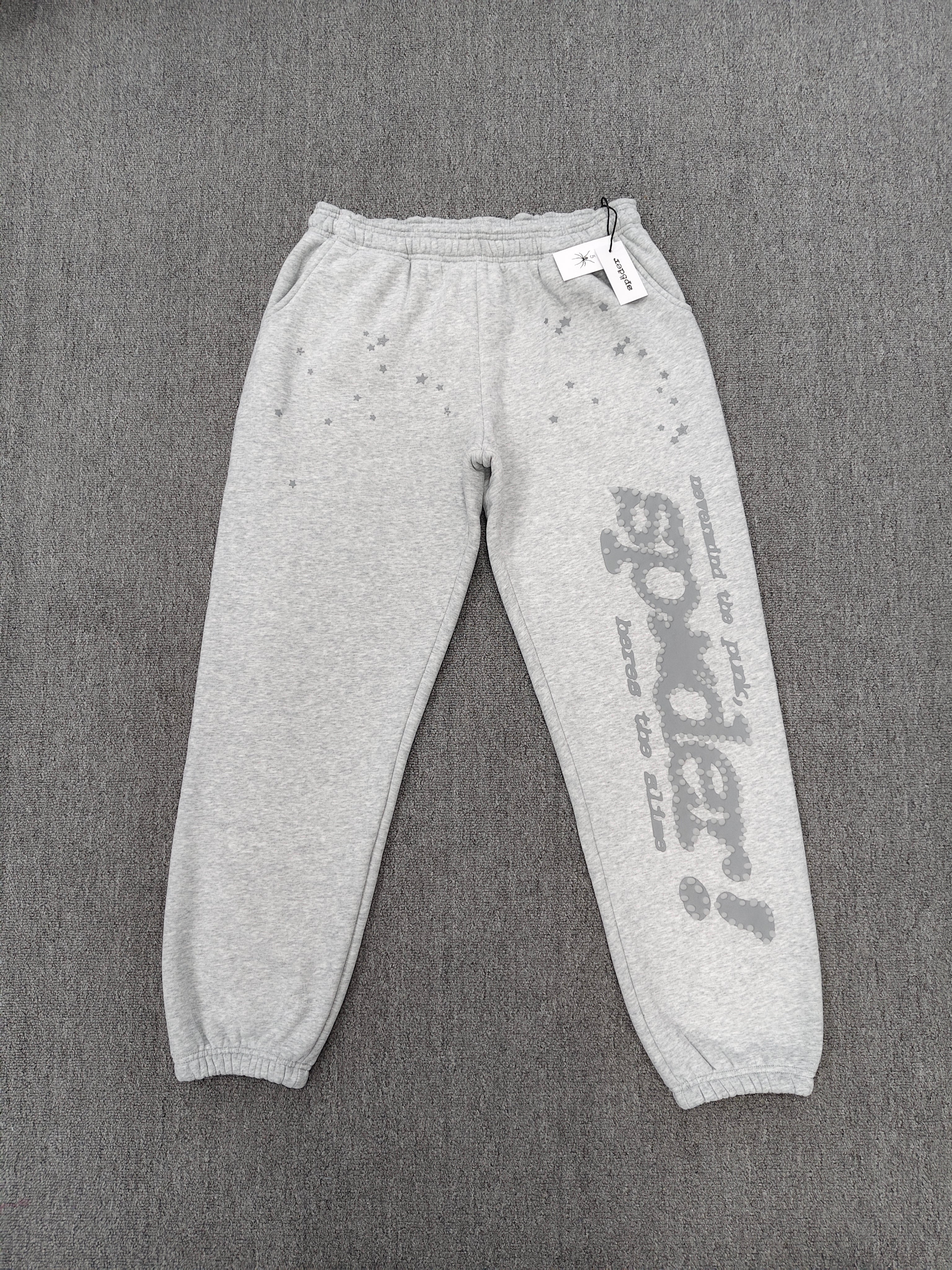 Sp5der Tonal Punk V2 sweatpants in Sport Grey feature scattered star prints and a large graphic logo down the leg