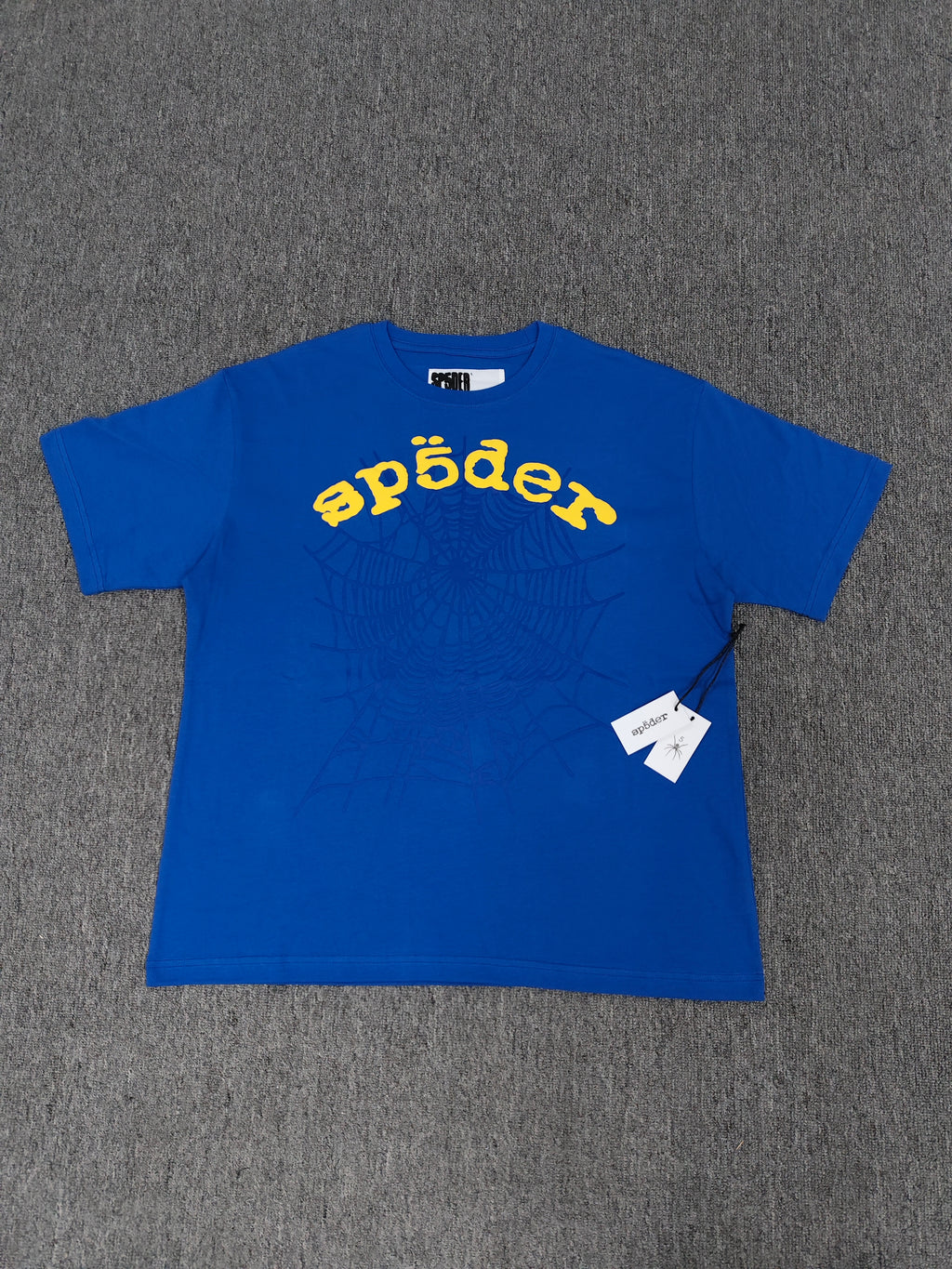 Sp5der shirts are featured in multiple colorways with prominent spiderweb branding
