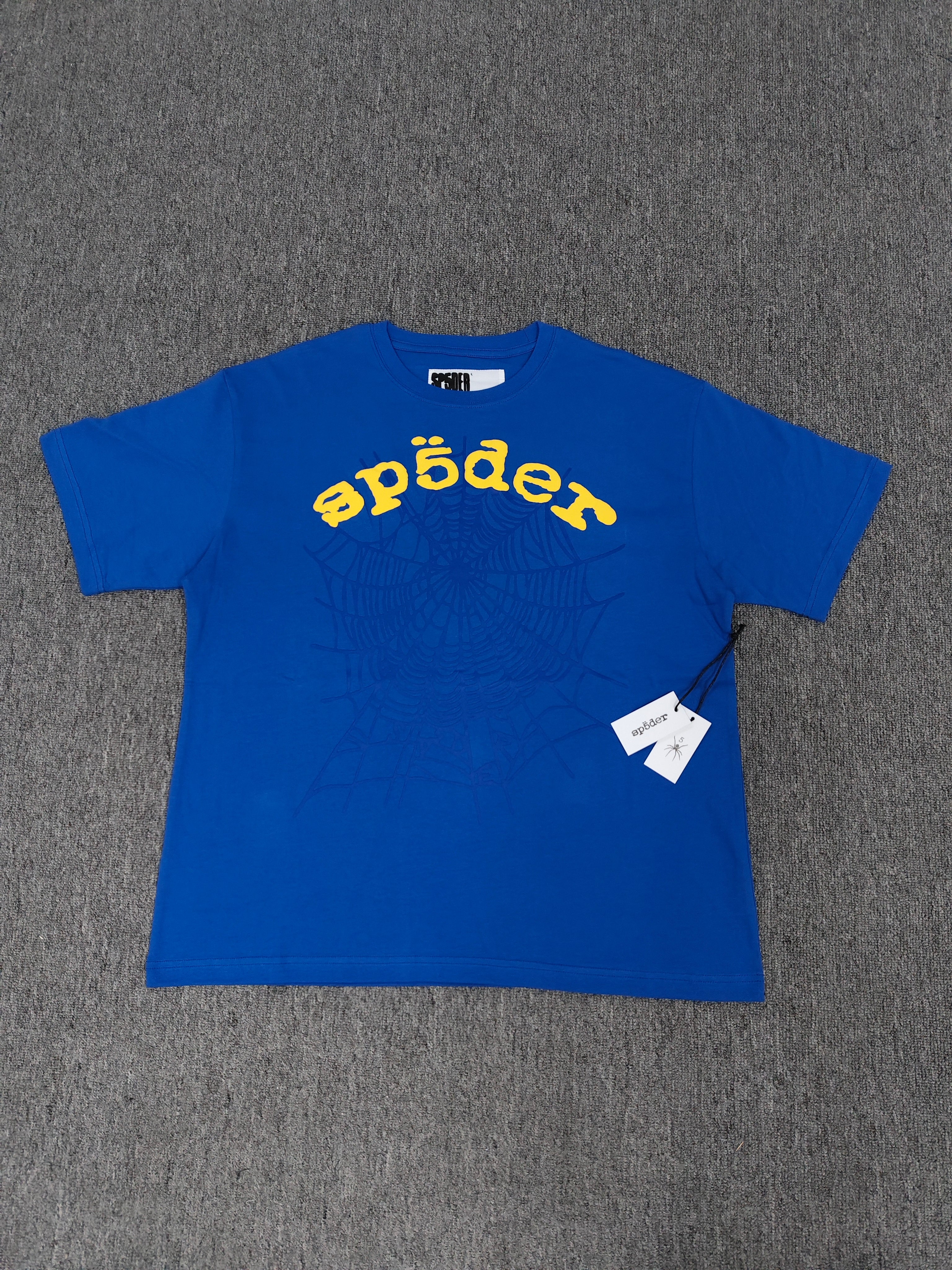 Sp5der shirts are featured in multiple colorways with prominent spiderweb branding