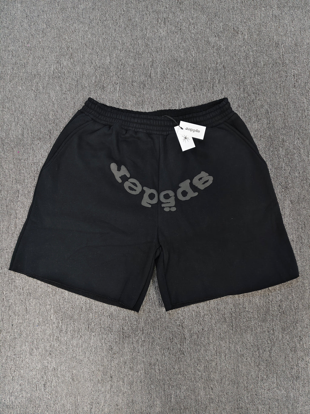 Sp5der OG Web V2 Phantom shorts in black feature a prominent rhinestone logo