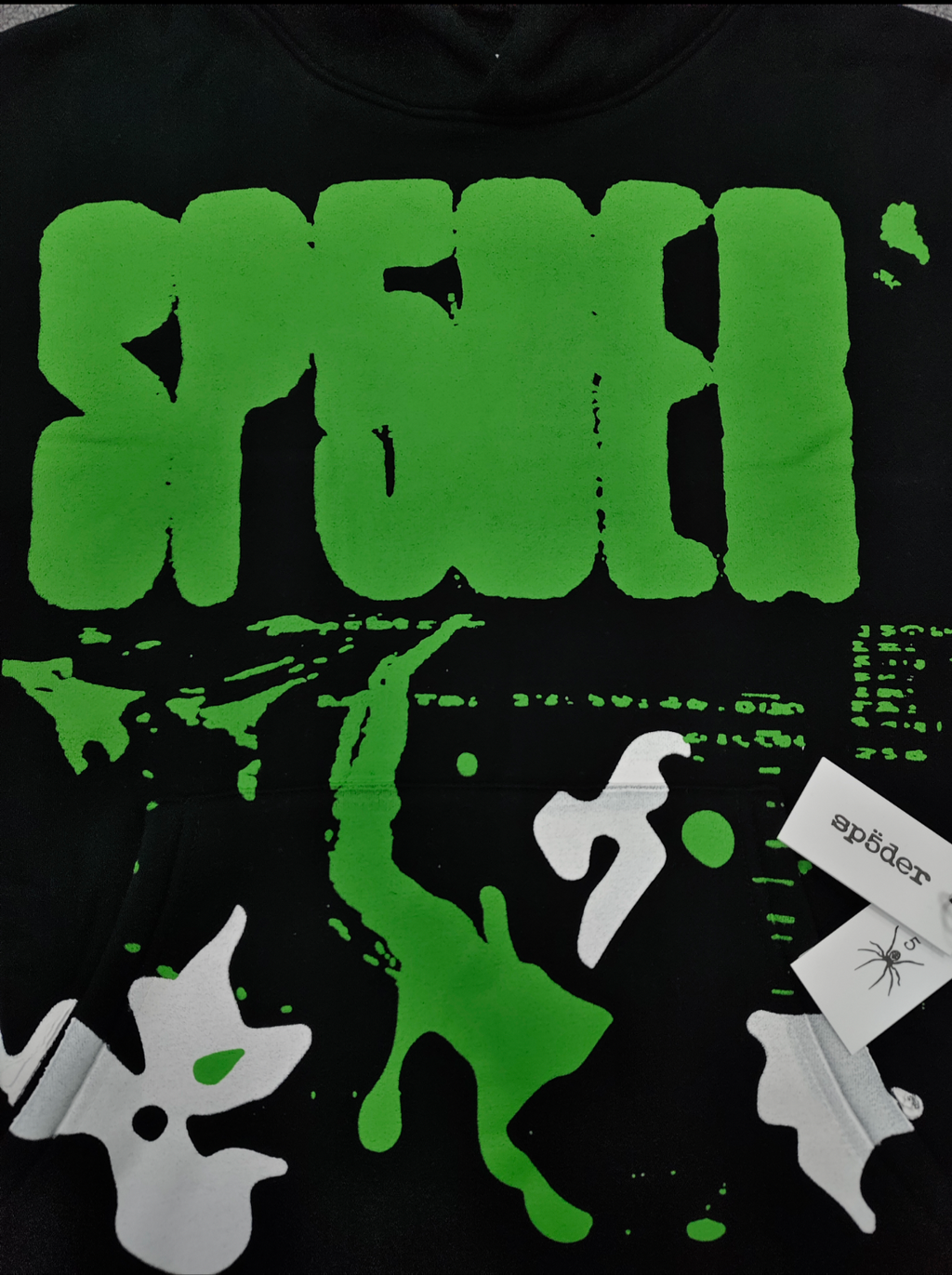black Sp5der X-Ray Hoodie featuring prominent neon green slime-style graphics