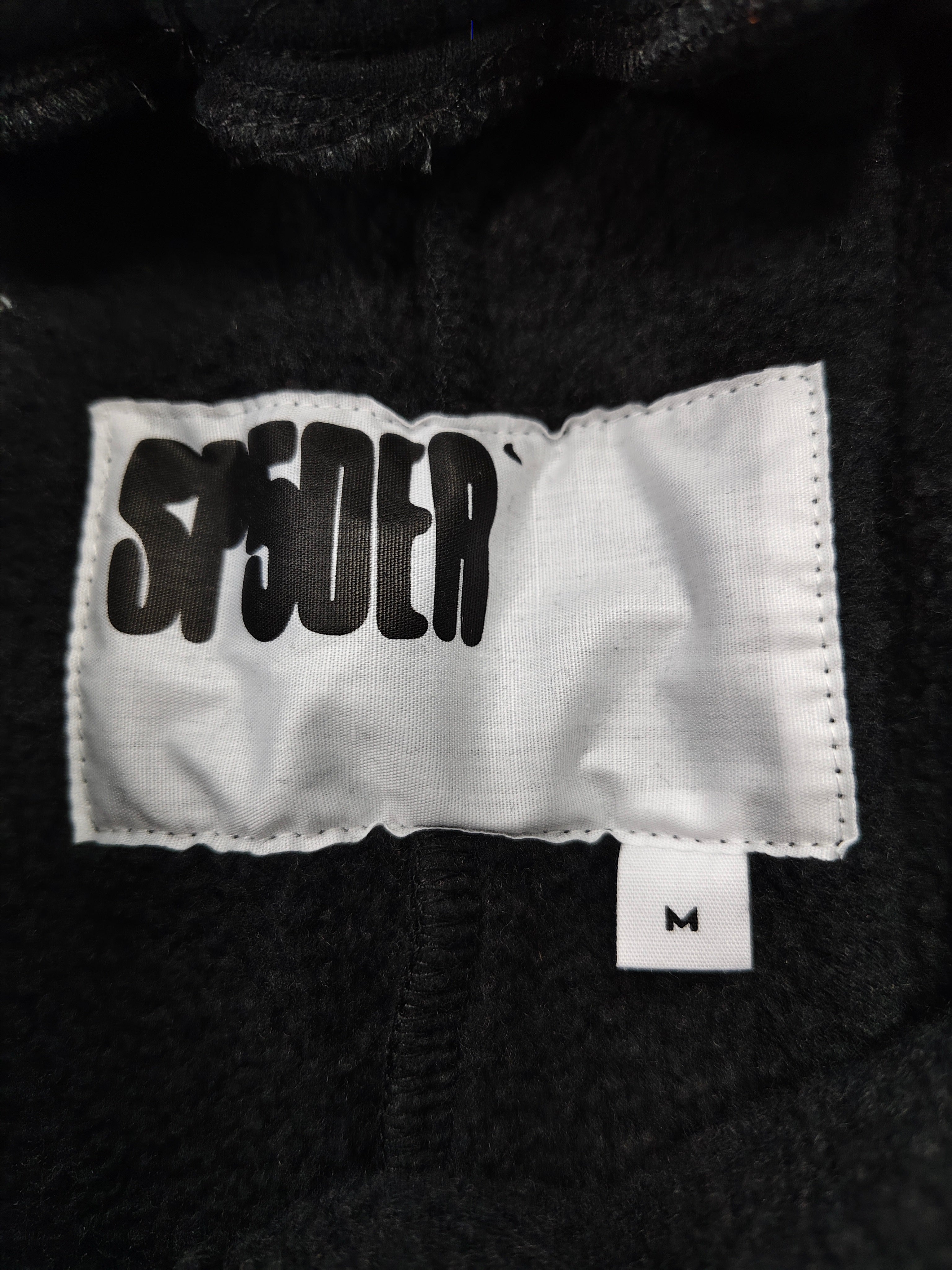 black Sp5der OG Web Logo sweatshorts featuring a prominent white puff-print logo and scattered star graphics