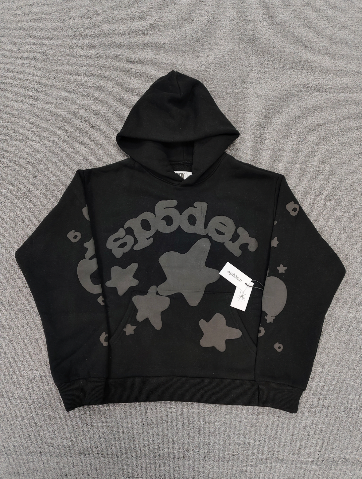 a Sp5der Reflective Beluga Hoodie in Black, featuring large reflective graphics