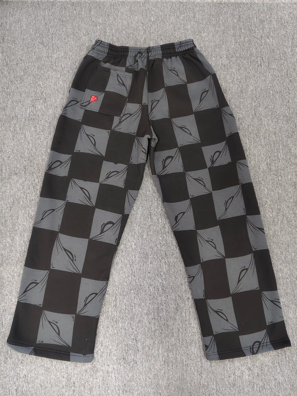 Chrome hearts Matty Boy Anti Promo 99 Eyes sweatpants in a black and grey checkerboard pattern.