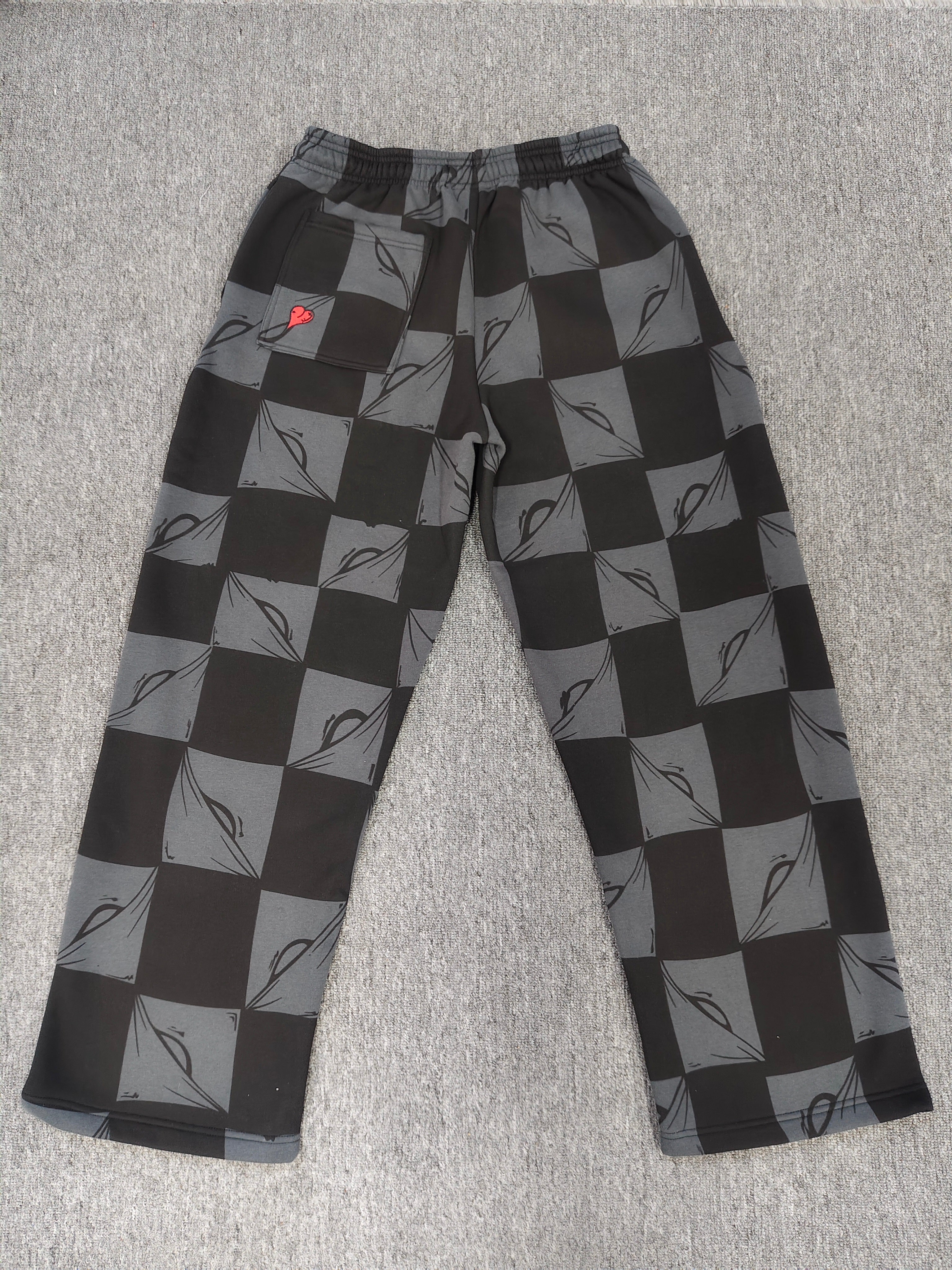 Chrome hearts Matty Boy Anti Promo 99 Eyes sweatpants in a black and grey checkerboard pattern.