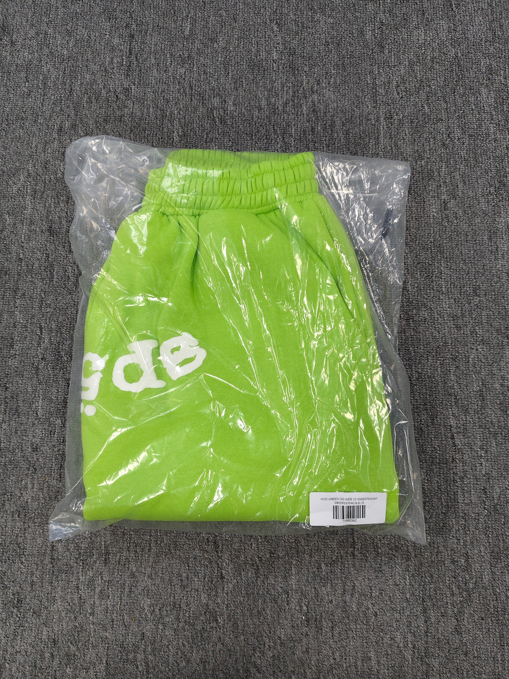 neon green Sp5der OG Web V2 sweatshorts feature a white logo print across the front