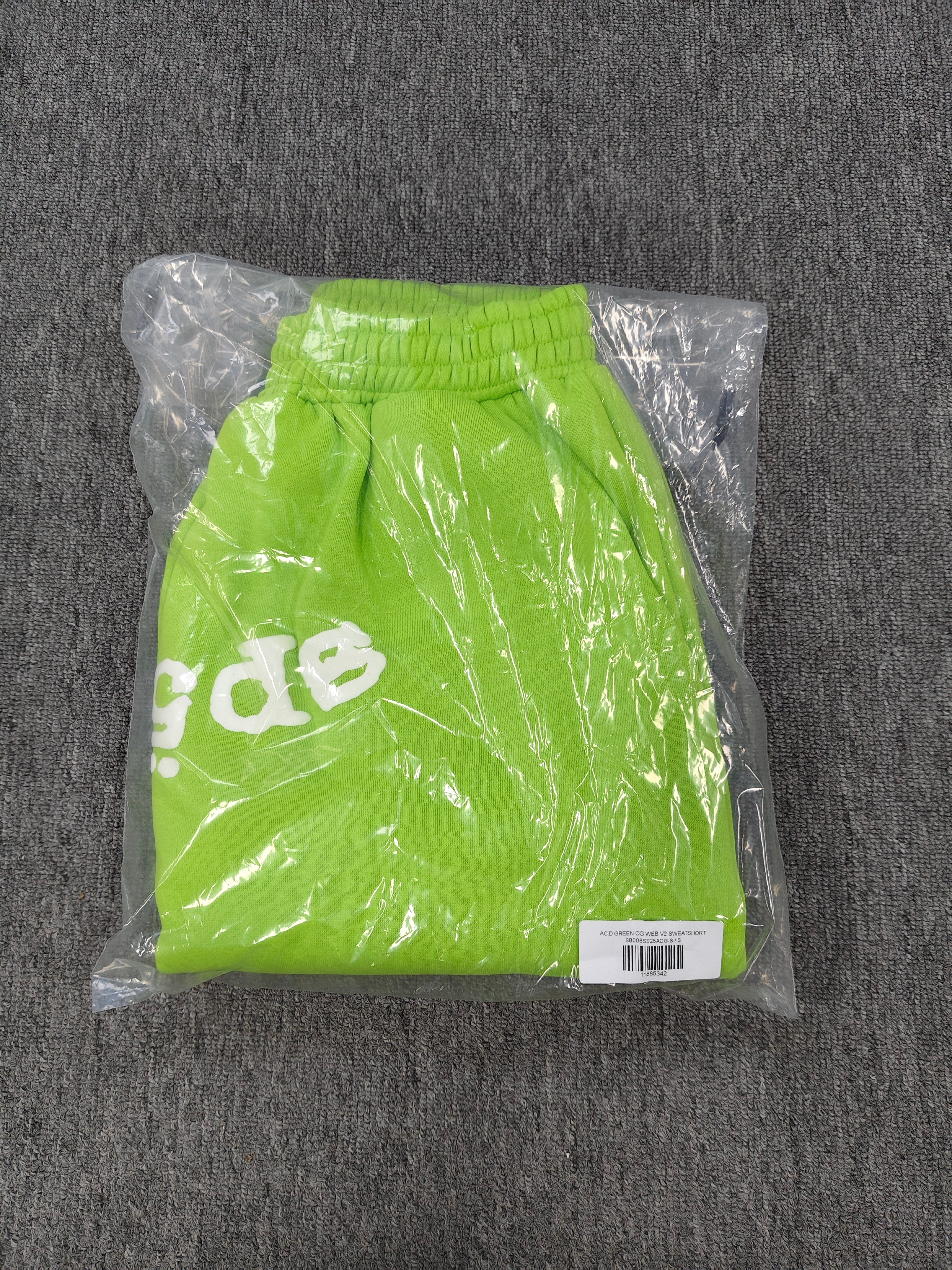 neon green Sp5der OG Web V2 sweatshorts feature a white logo print across the front