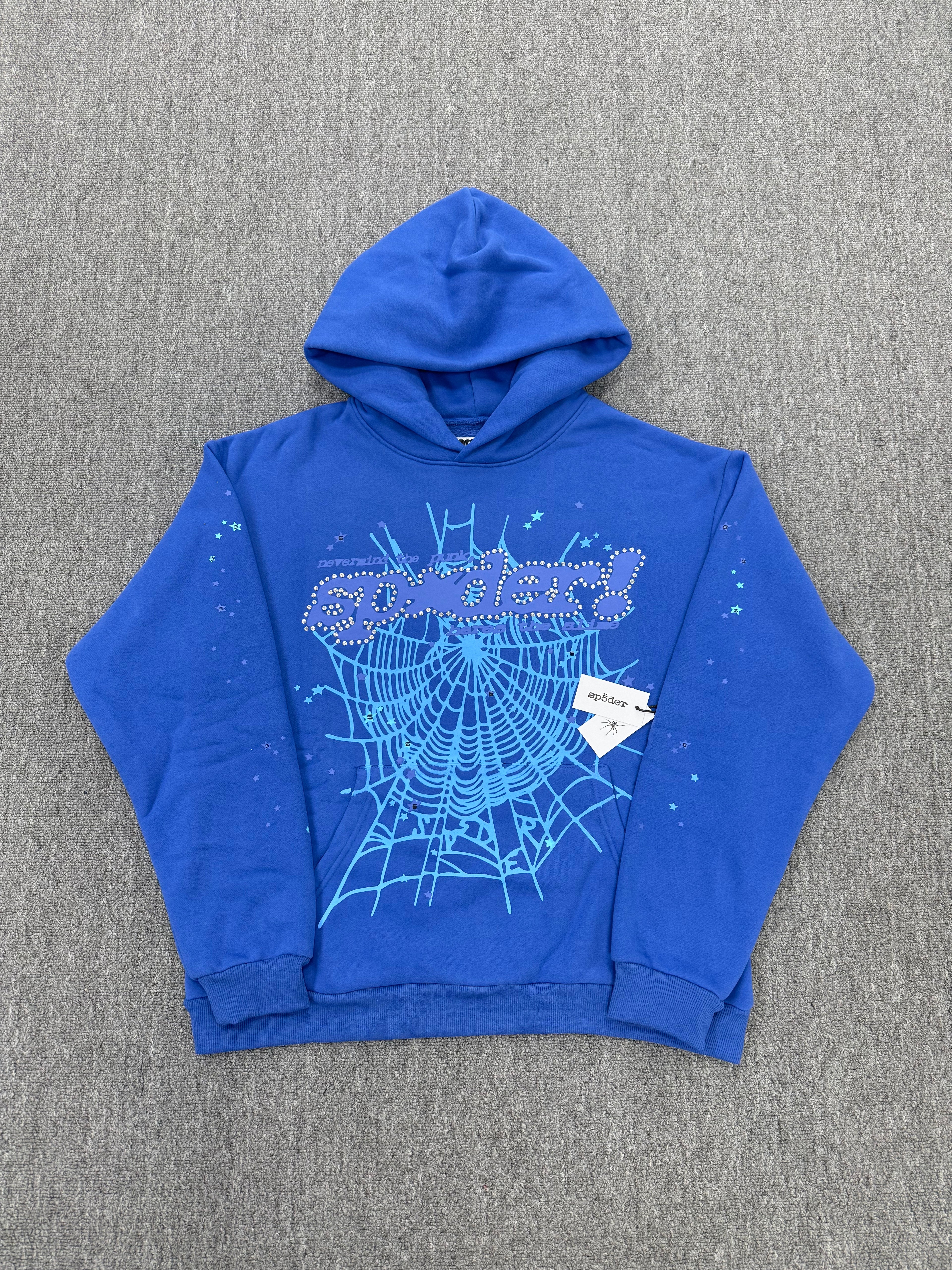blue hoodie is a SP5DER Punk V2 model featuring a prominent spider-web graphic with rhinestone embellishments