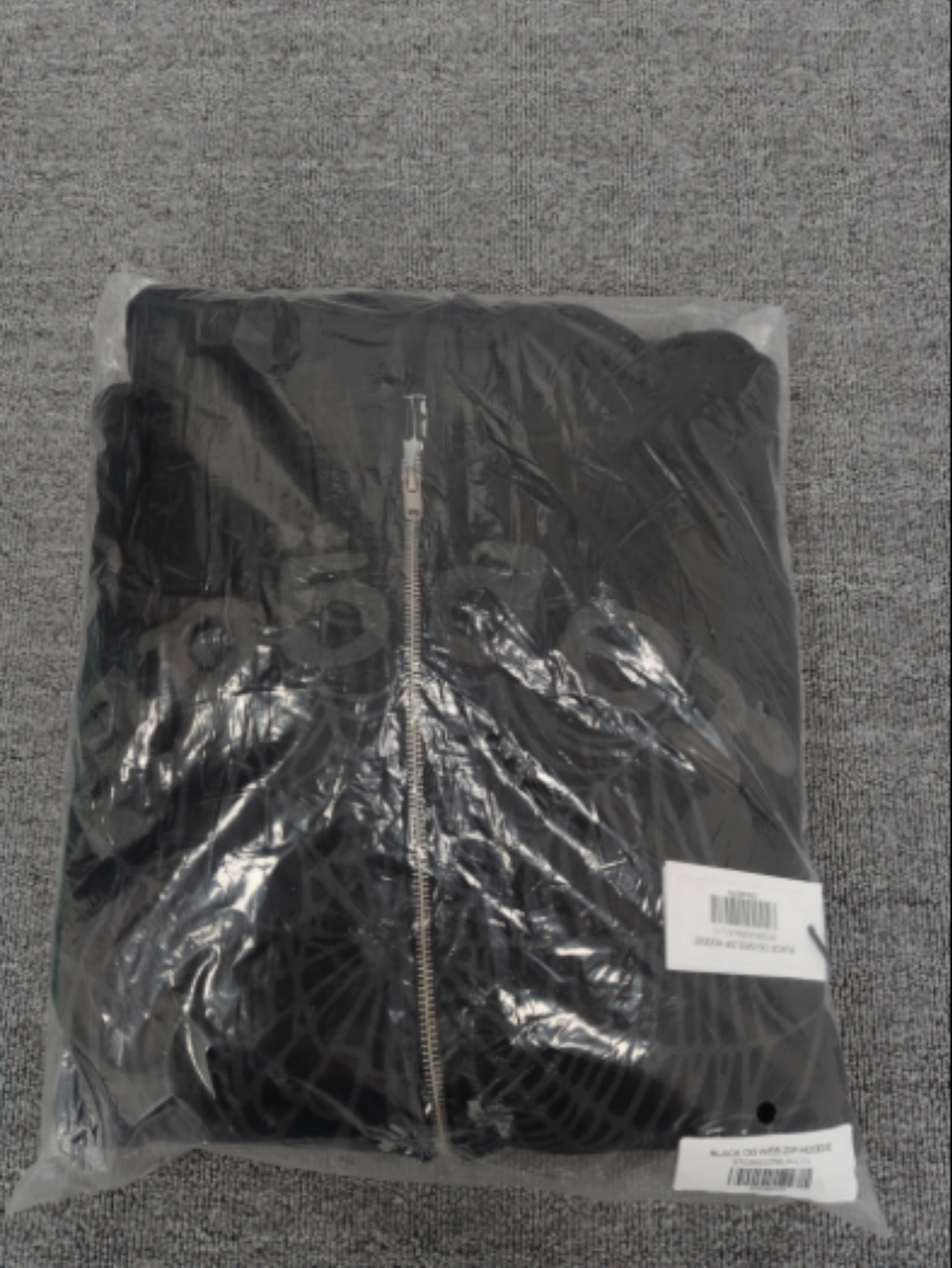 Sp5der OG Web V2 Phantom Zip Up hoodie features a black colorway with a prominent puff-printed web graphic on the front