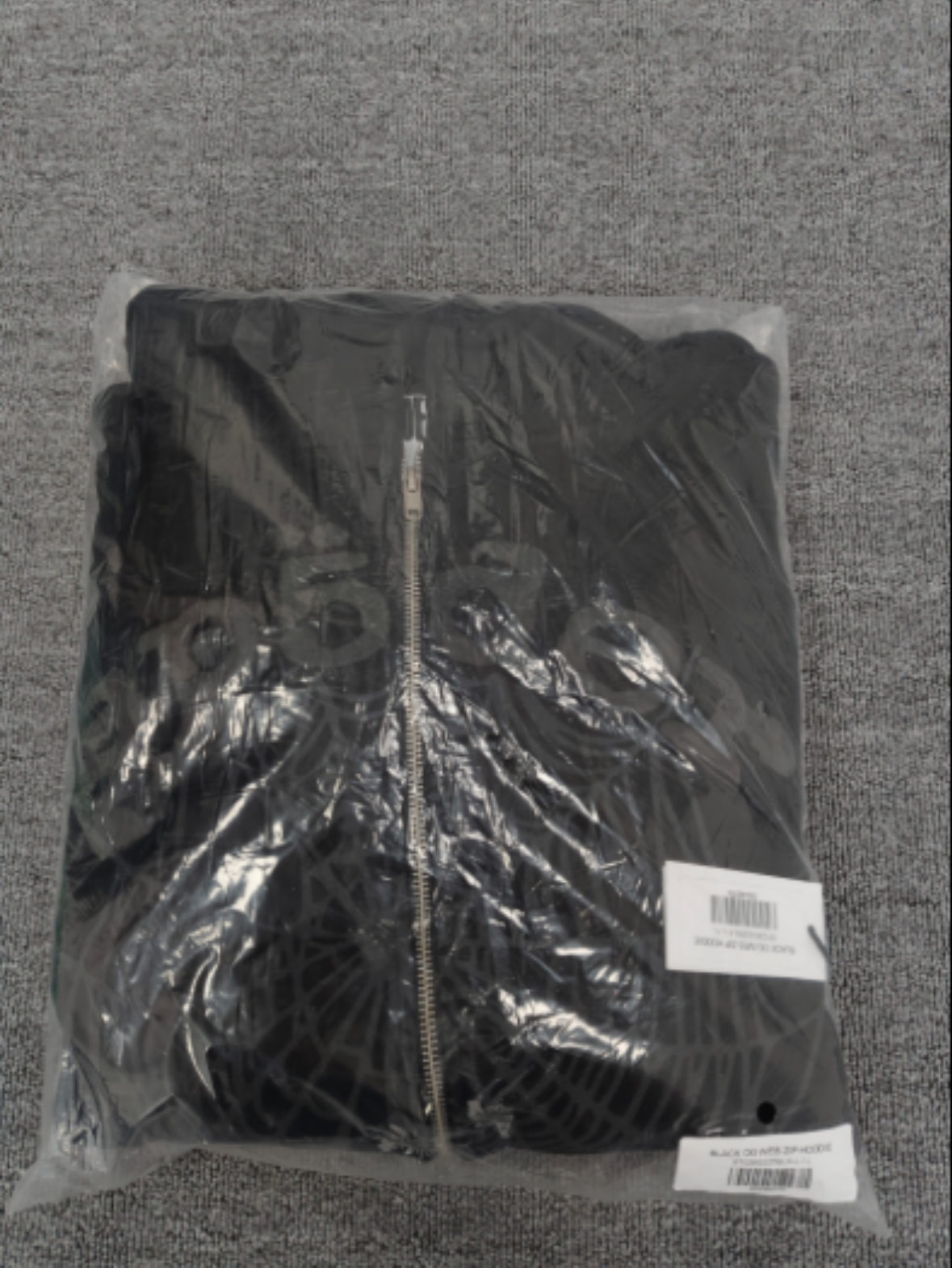 Sp5der OG Web V2 Phantom Zip Up hoodie features a black colorway with a prominent puff-printed web graphic on the front