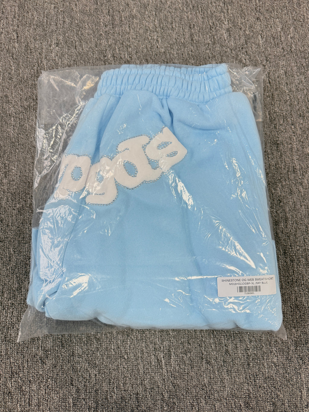 Sp5der OG Web Sweatshorts in Sky Blue, featuring the brand's signature webbed logo graphic on the front
