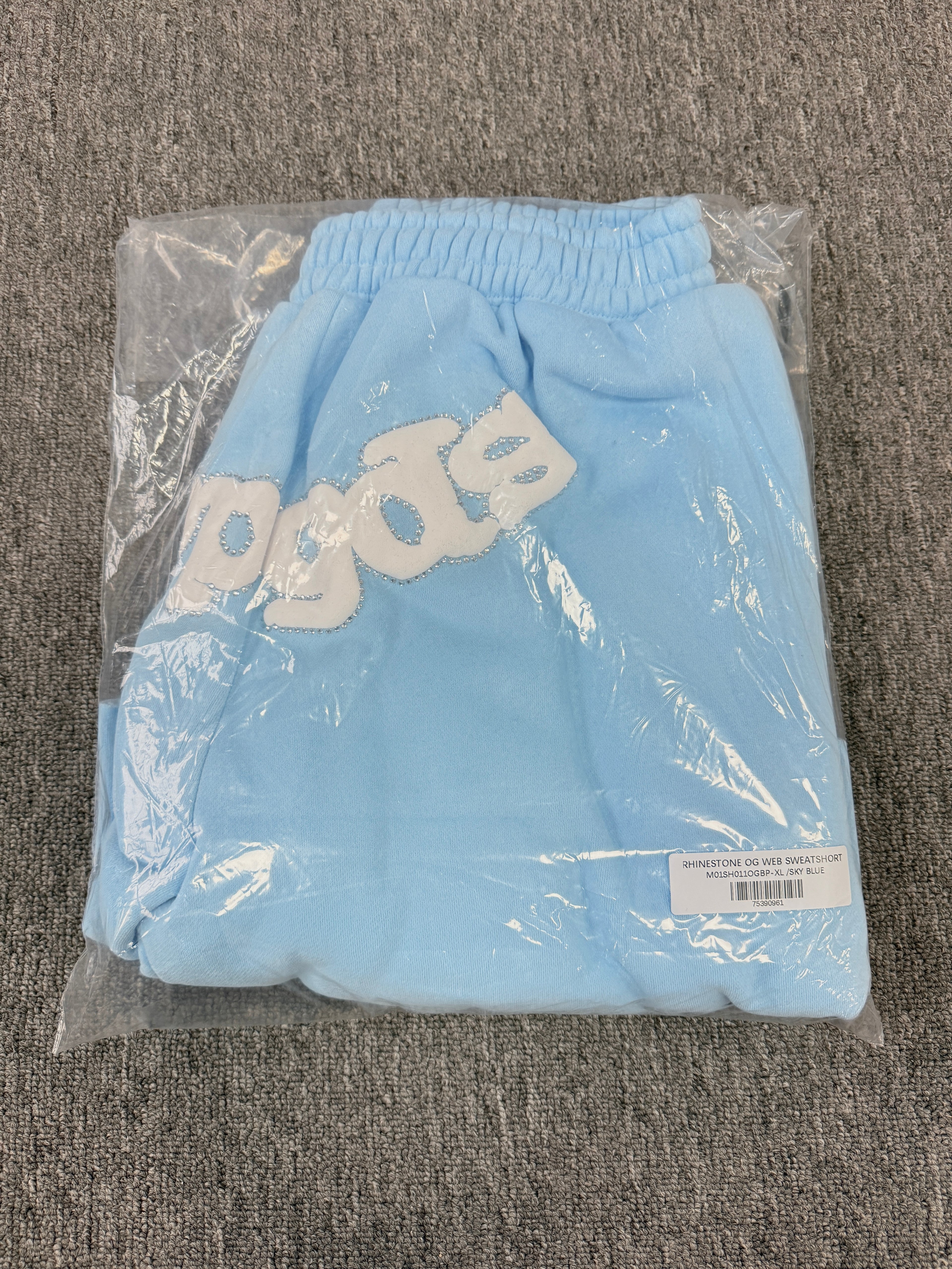 Sp5der OG Web Sweatshorts in Sky Blue, featuring the brand's signature webbed logo graphic on the front