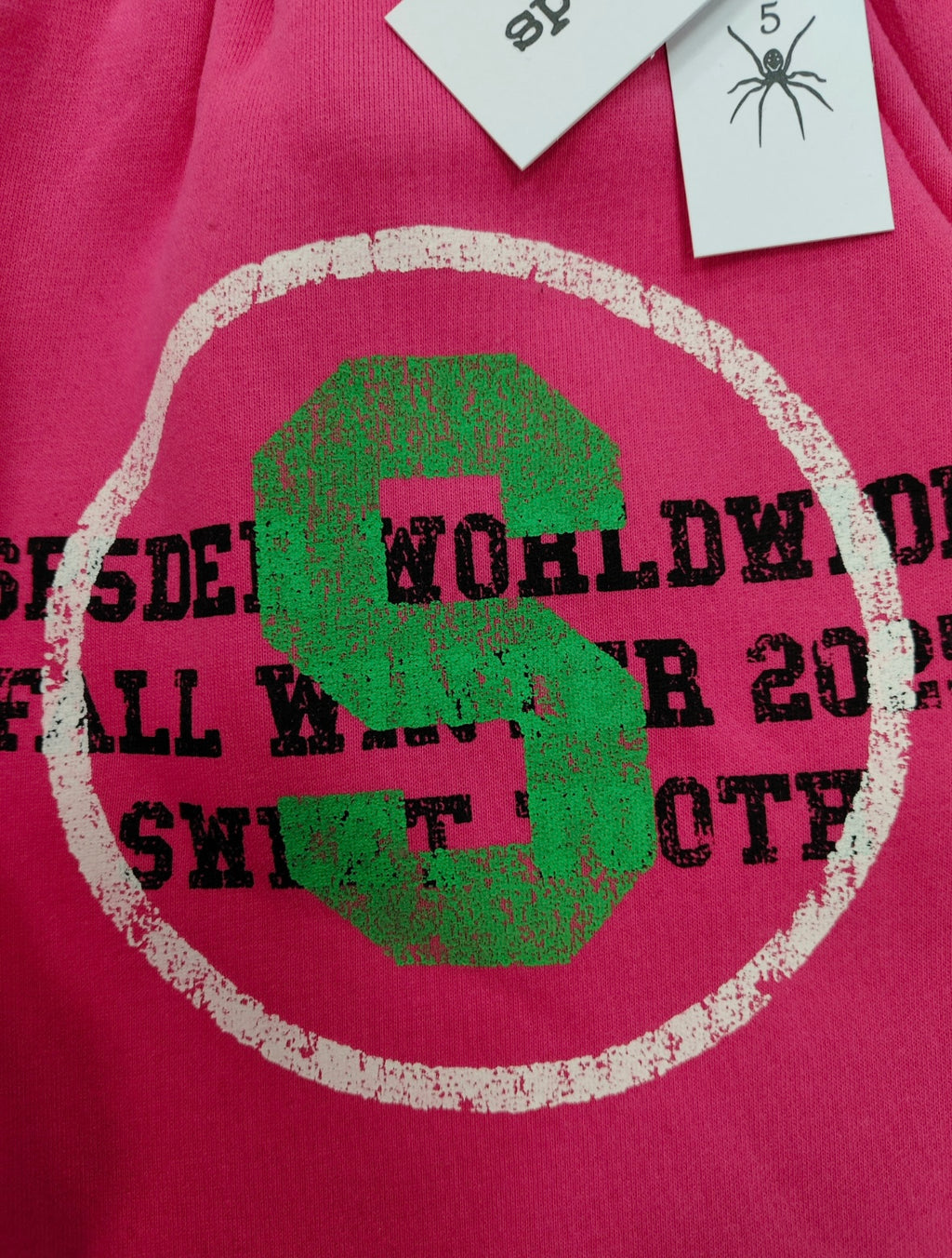 SP5DER Stencil Sweatpants in pink, featuring a large black star graphic on the left leg