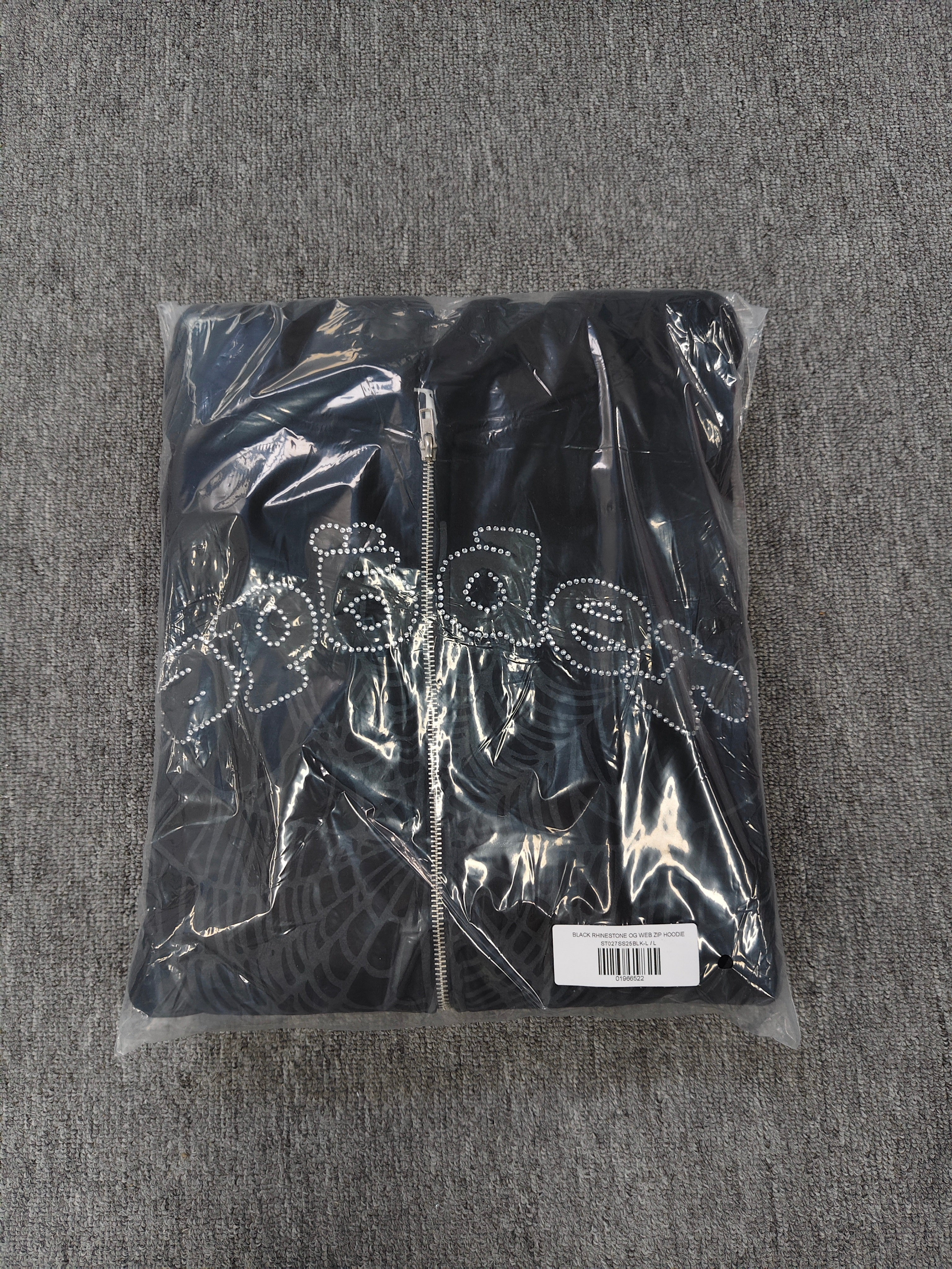 black Sp5der OG Web V2 Phantom Zip Up Hoodie features a prominent rhinestone-embellished logo and web graphic