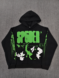 black Sp5der X-Ray Hoodie featuring prominent neon green slime-style graphics