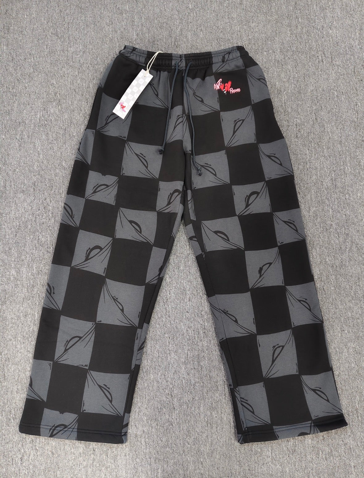 Chrome hearts Matty Boy Anti Promo 99 Eyes sweatpants in a black and grey checkerboard pattern.