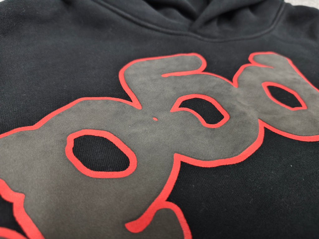 a black Sp5der Beluga Outline Hoodie featuring red-outlined star graphics
