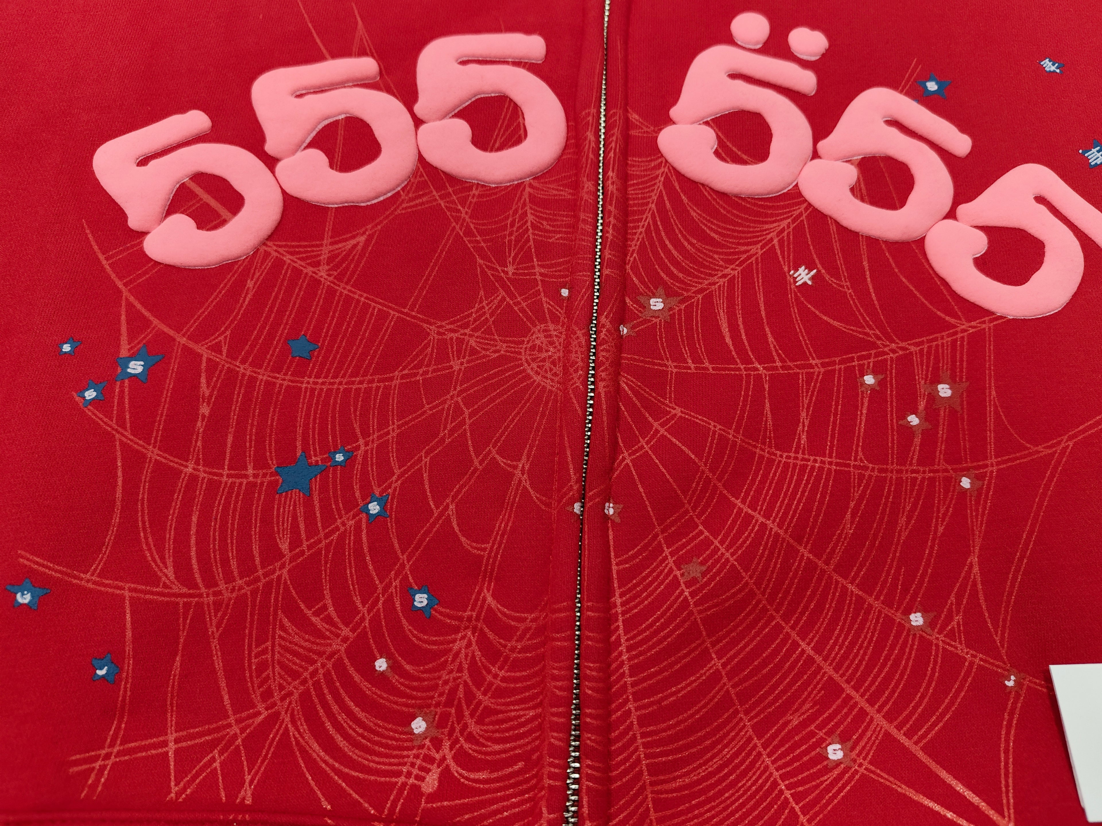 Sp5der Angel Number zip hoodie in red features a prominent sparkly spider web graphic on the chest