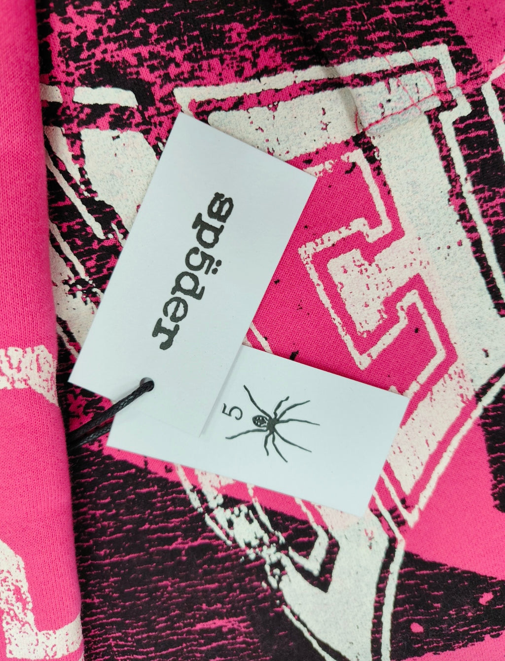 SP5DER Stencil hoodie featuring distressed white graphic branding and black star motifs