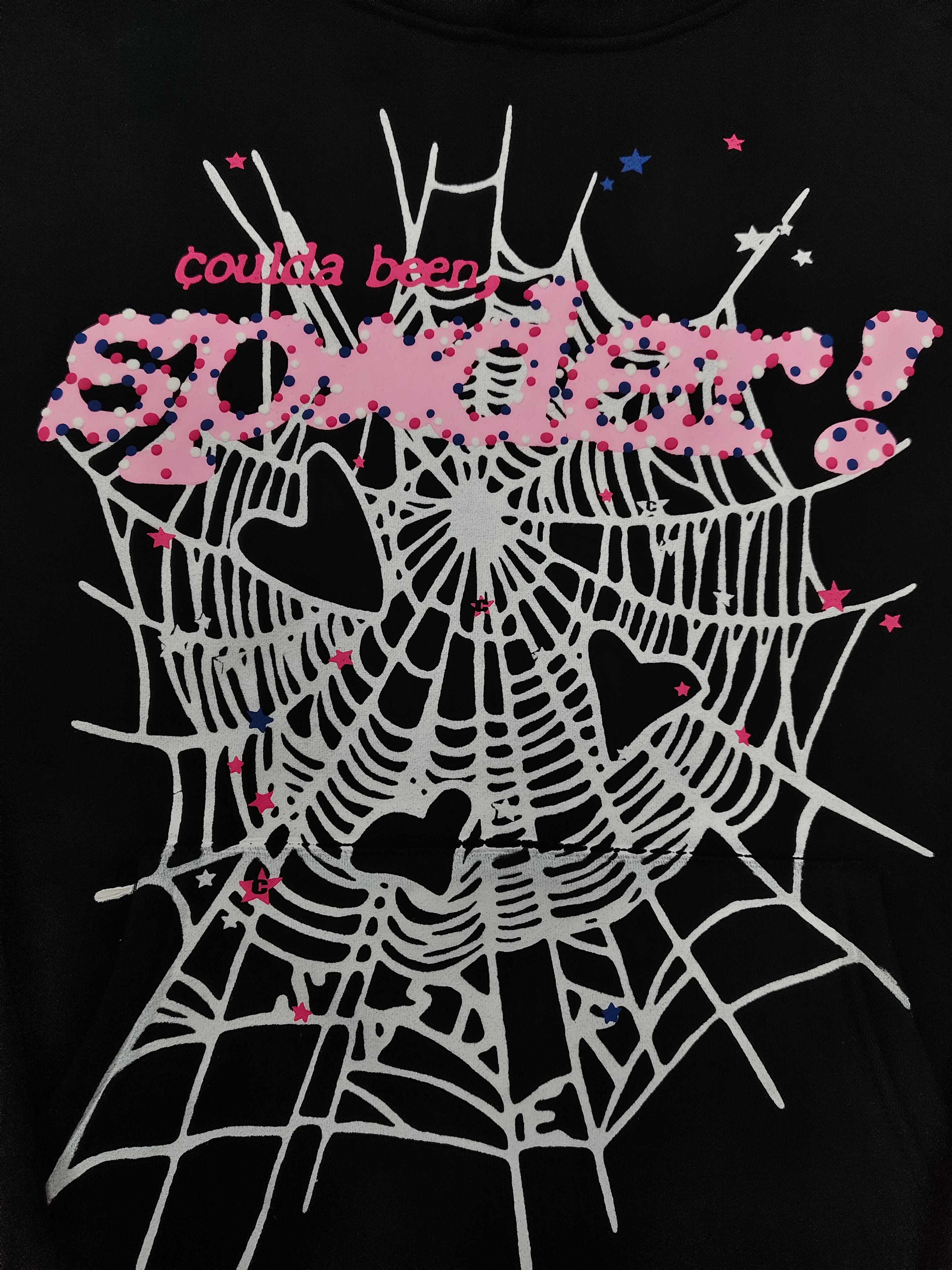 SP5DER CB Punk V2 Hoodie features a bold pink and white cobweb graphic on the chest