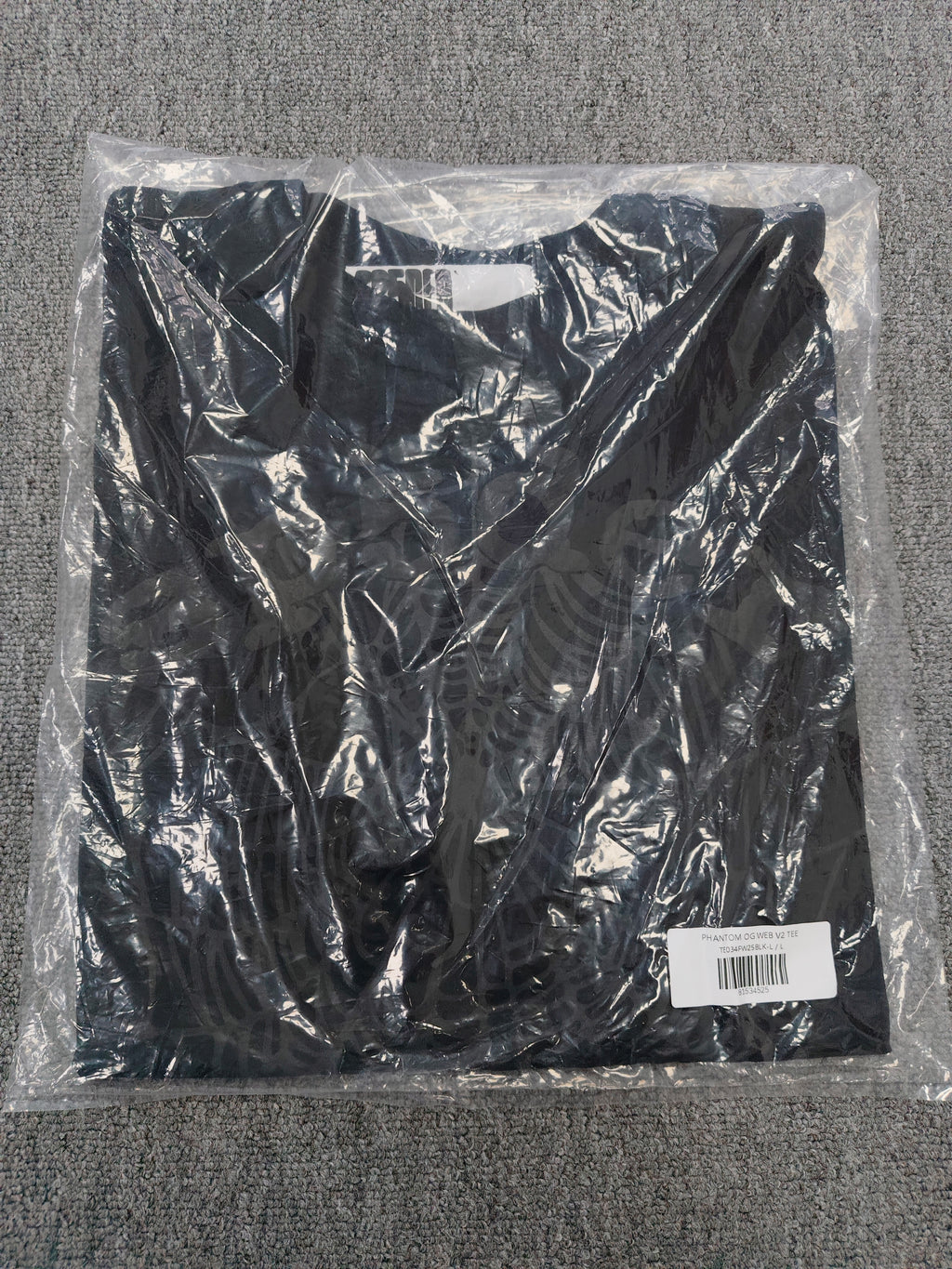 Sp5der Phantom OG Web Tee in black features a large gray spiderweb graphic on the chest