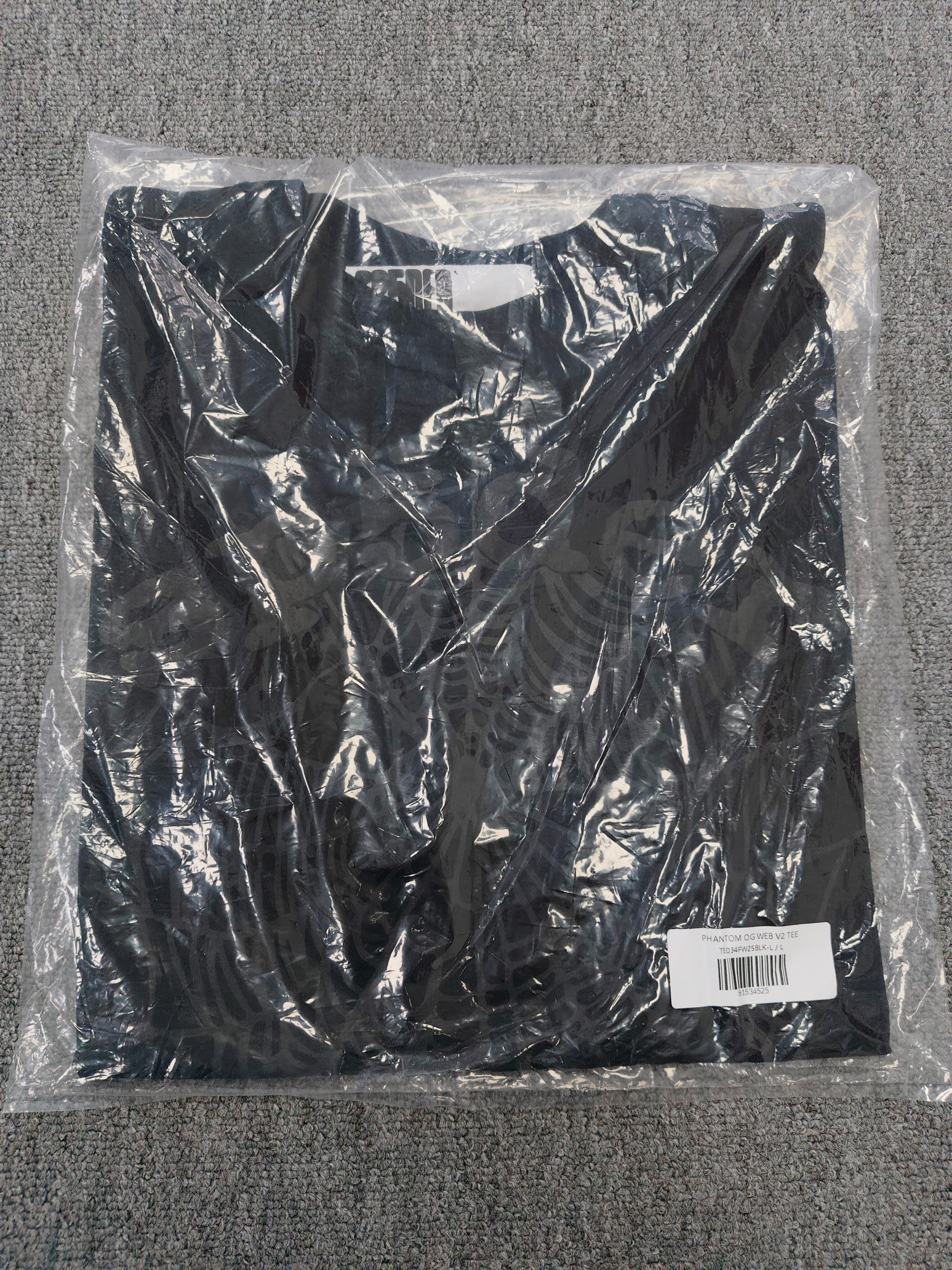 Sp5der Phantom OG Web Tee in black features a large gray spiderweb graphic on the chest