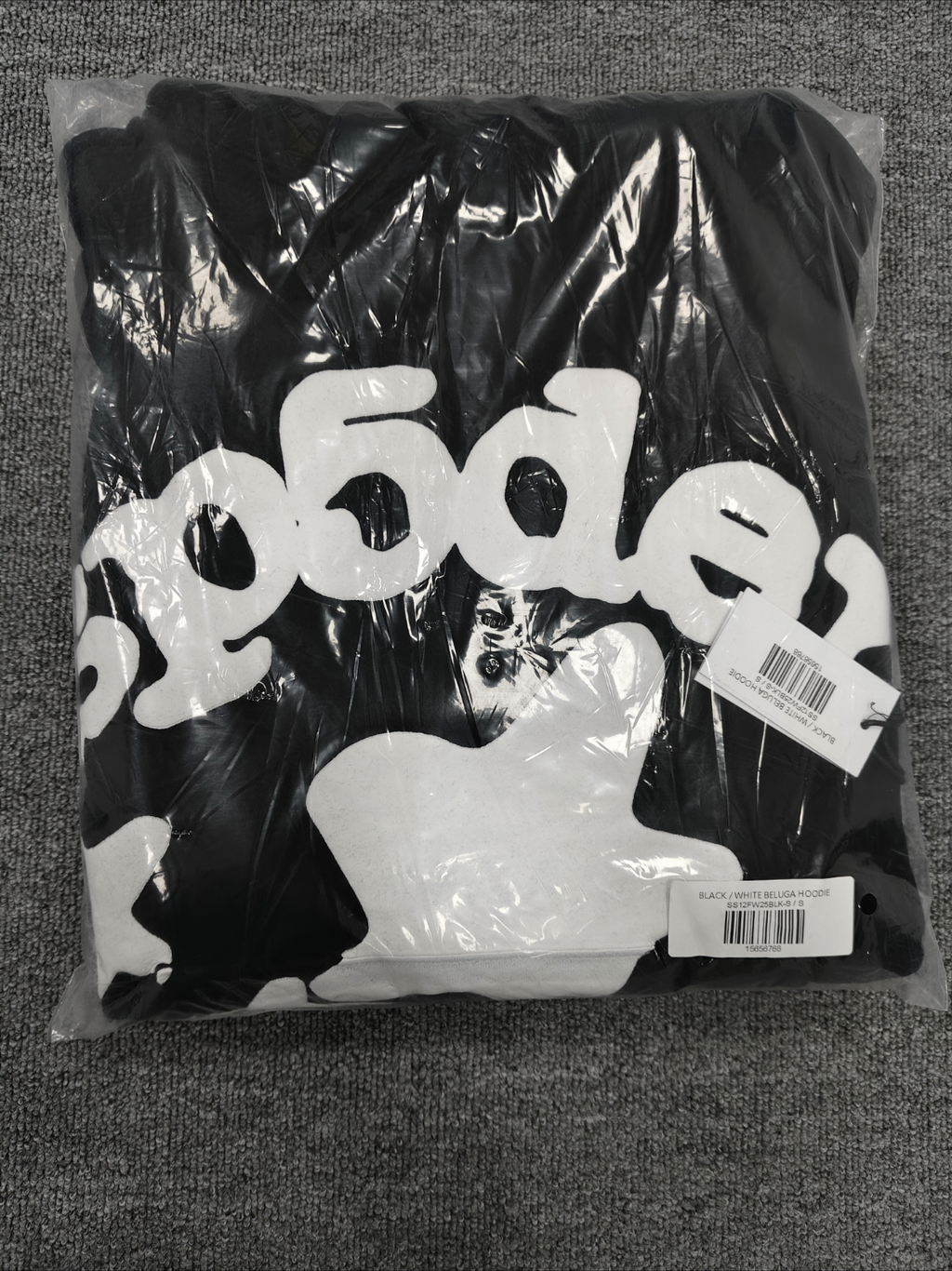 black Sp5der hoodie features reflective white graphic prints of the brand name and stars