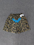 Sp5der OG Web V2 Tiger Camo Sweatshorts featuring a prominent tiger stripe pattern and an elasticated waistband