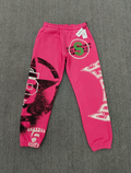 SP5DER Stencil Sweatpants in pink, featuring a large black star graphic on the left leg