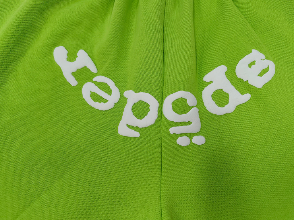 neon green Sp5der OG Web V2 sweatshorts feature a white logo print across the front