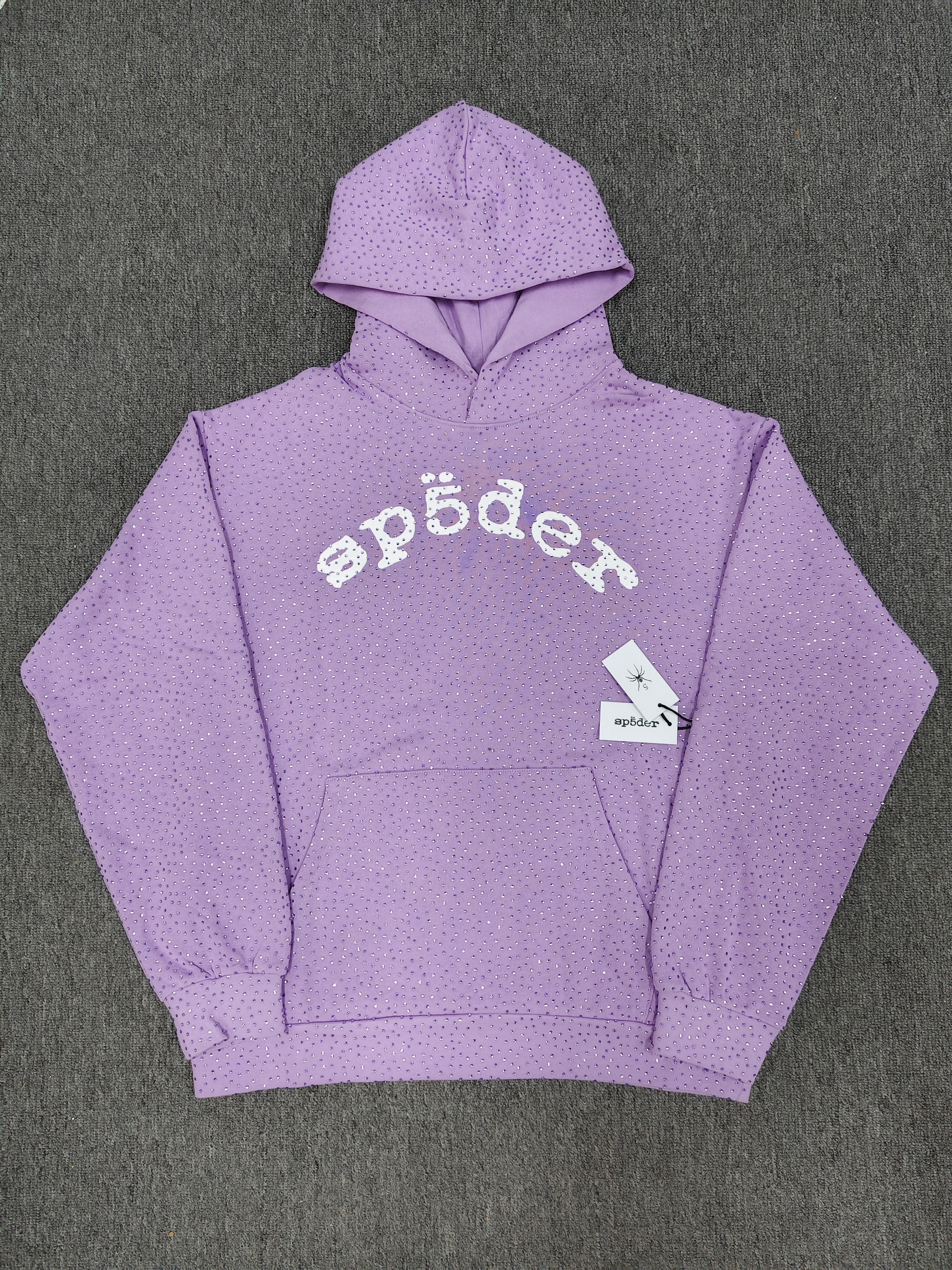 light purple Sp5der rhinestone arch logo hoodie is crafted from cotton fleece and features a glittering finish