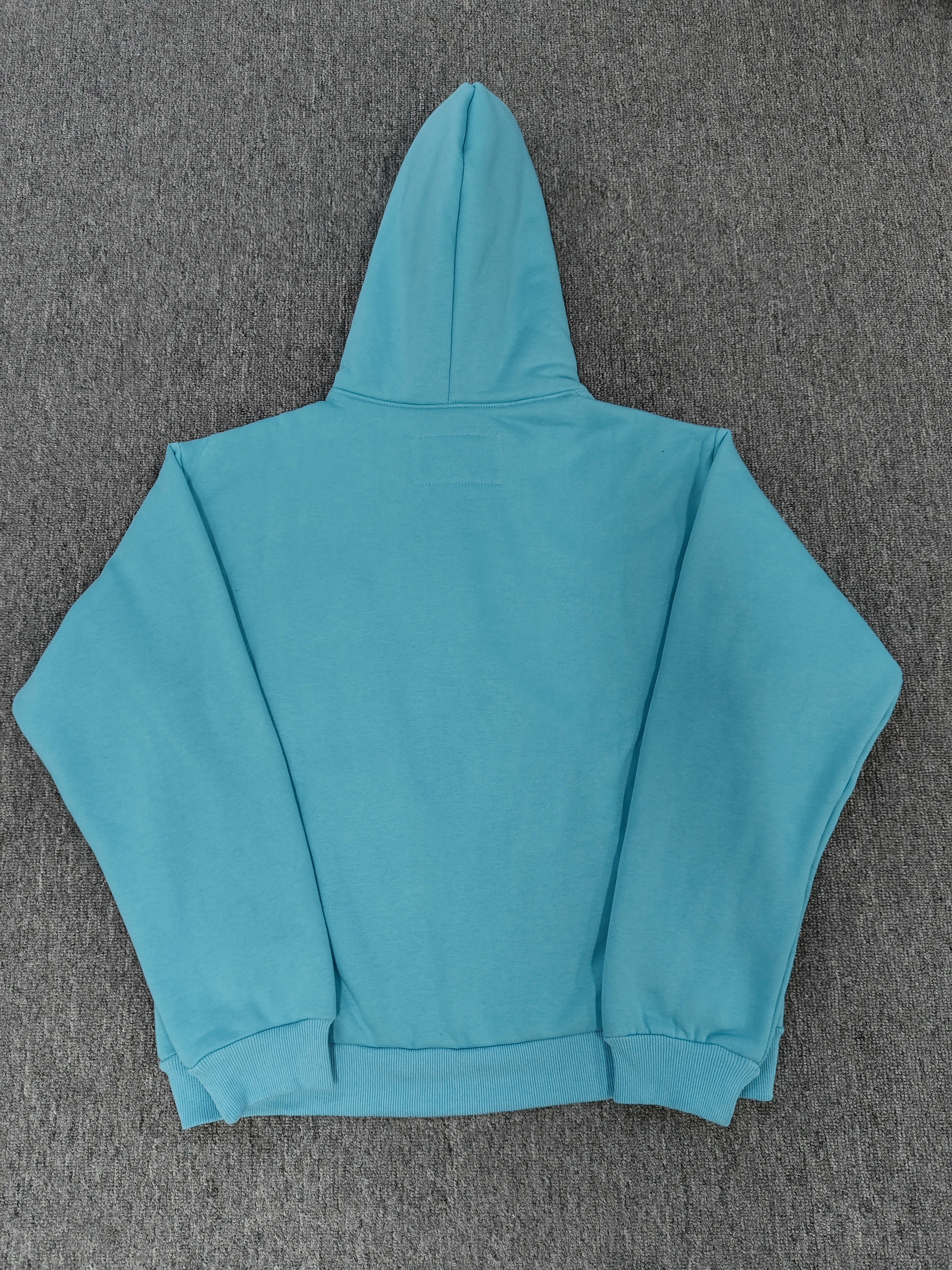 light blue Sp5der OG Web V2 Spray Hoodie features a prominent, sprayed-on navy spiderweb graphic