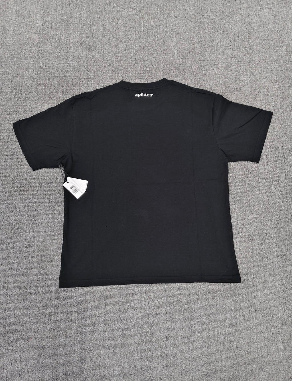 a black SP5DER Diffused Collegiate T-shirt featuring a large white, distressed graphic logo