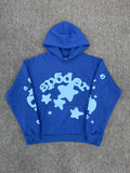 blue Sp5der Beluga hoodie features a distinct light blue graphic print of stars and the brand name on the front and sleeves