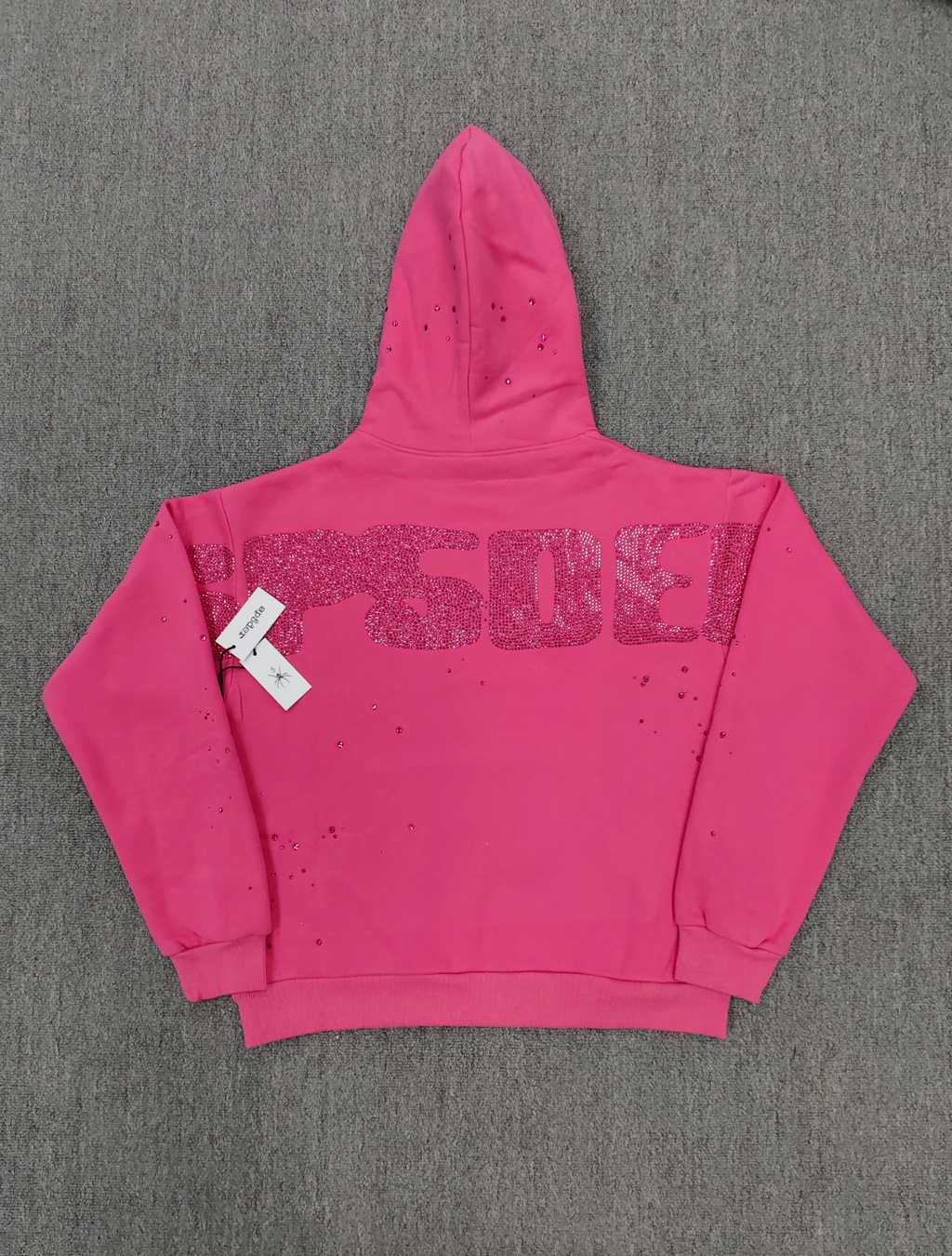 Sp5der Rhinestone Silk Hoodie in pink featuring a prominent rhinestone spiderweb graphic