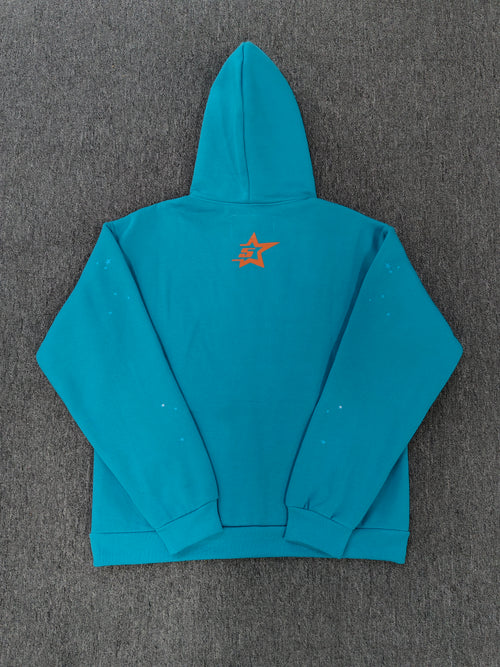 a Sp5der Punk V2 Hoodie in the Cyan colorway, featuring a prominent rhinestone graphic and spider web motif