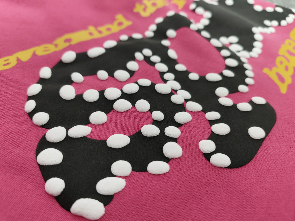 pink shorts Sp5der "Punk V2" collection, featuring rhinestone branding and scattered star graphics