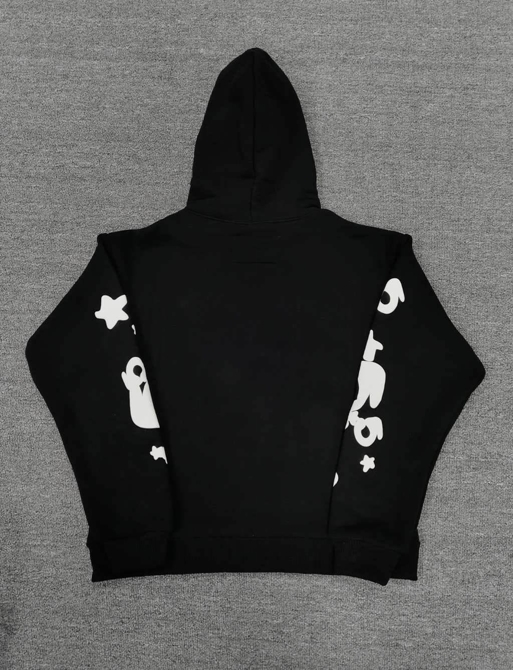 black Sp5der hoodie features reflective white graphic prints of the brand name and stars