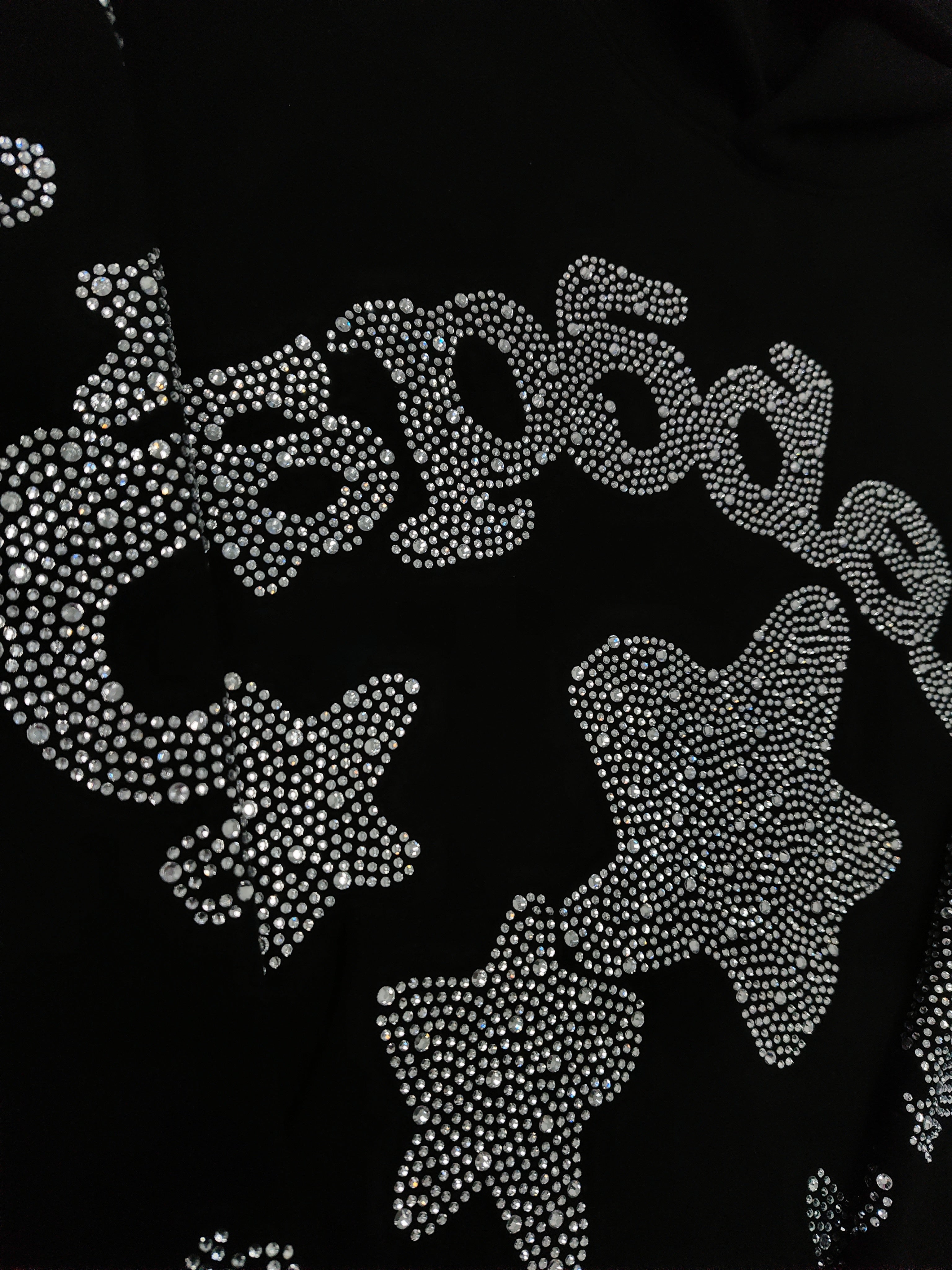 a Sp5der black rhinestone star logo hoodie