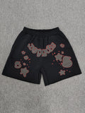 Sp5der Beluga Outline Sweatshorts in black, featuring prominent red-outlined graphic logos and stars