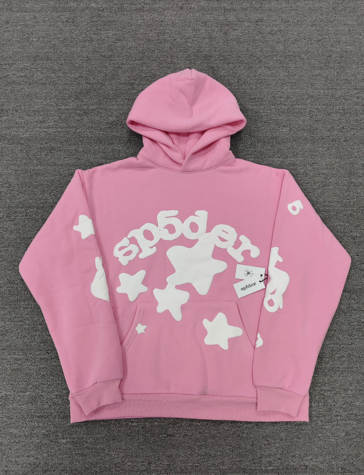 Sp5der pink graphic pullover hoodie features a prominent white screen-printed spiderweb design on the front