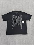 a black SP5DER Diffused Collegiate T-shirt featuring a large white, distressed graphic logo