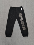 Sp5der Rhinestone Silk sweatpants in black featuring a large rhinestone-embellished logo and scattered star details
