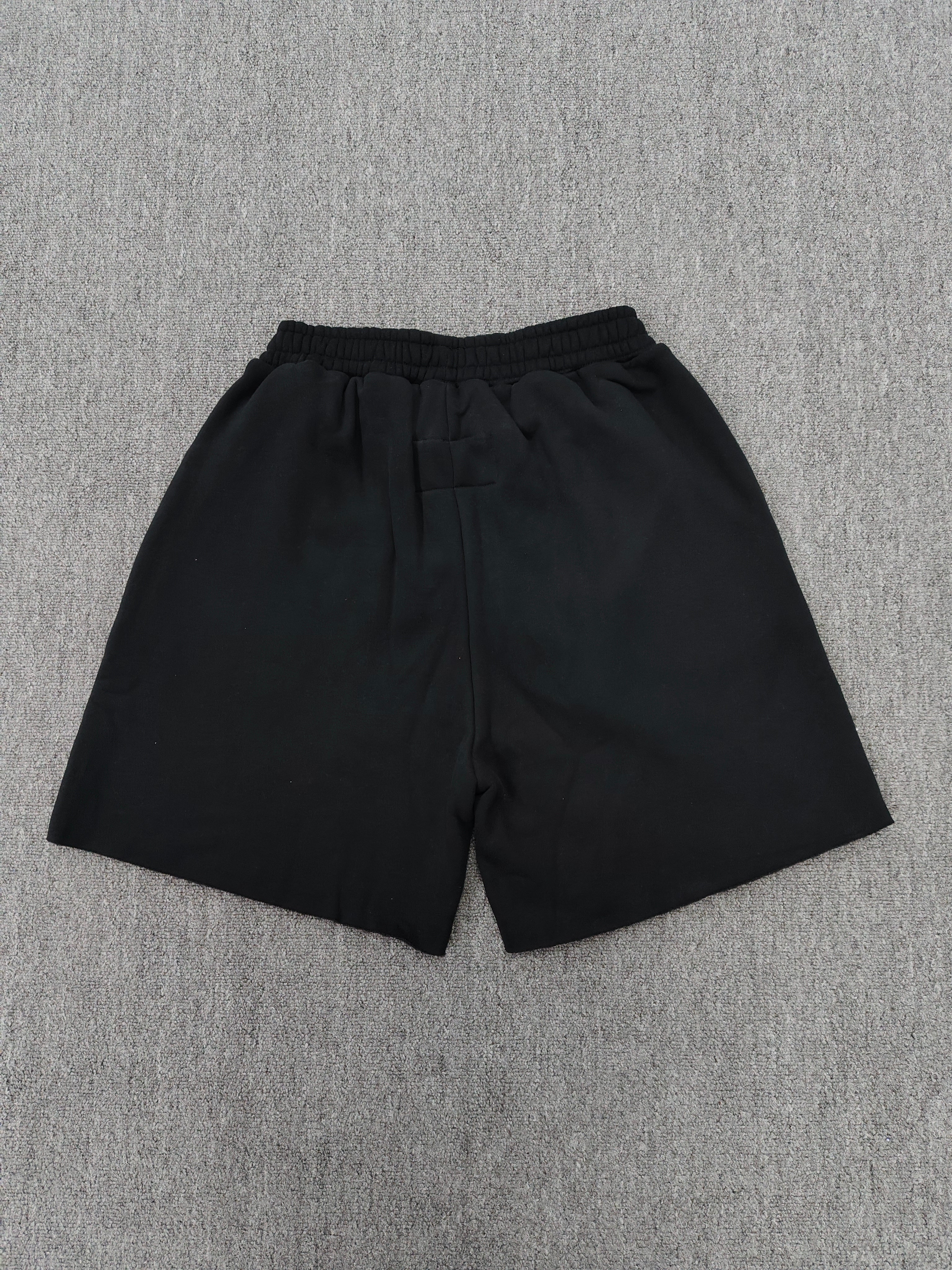 black Sp5der OG Web Logo sweatshorts featuring a prominent white puff-print logo and scattered star graphics