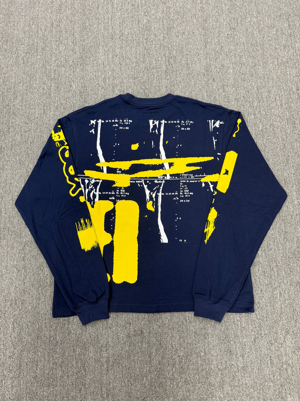 navy blue Sp5der X-Ray Longsleeve featuring bright yellow graphics on the front and sleeves