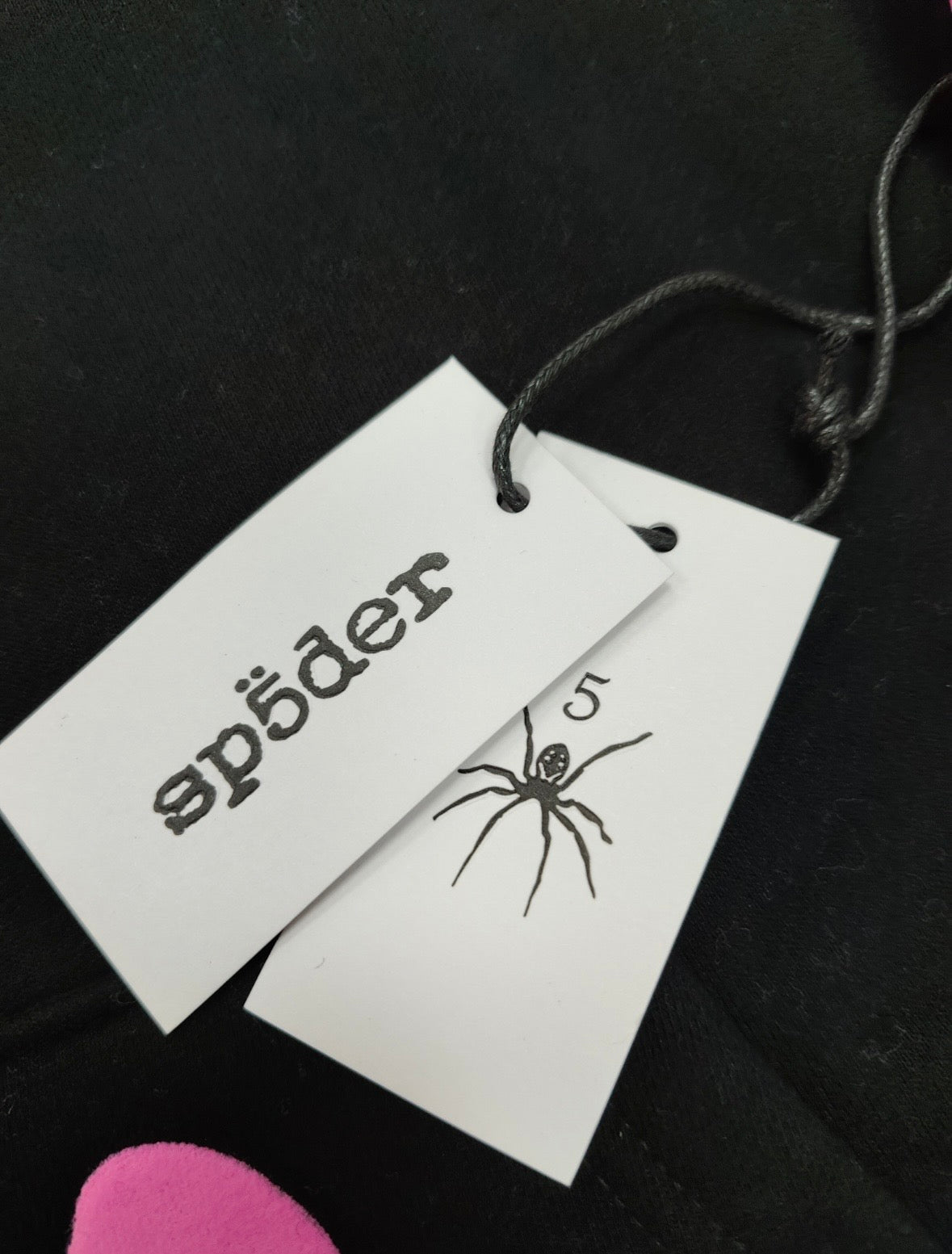 Sp5der Angel Number Beluga Hoodie in black with pink graphics