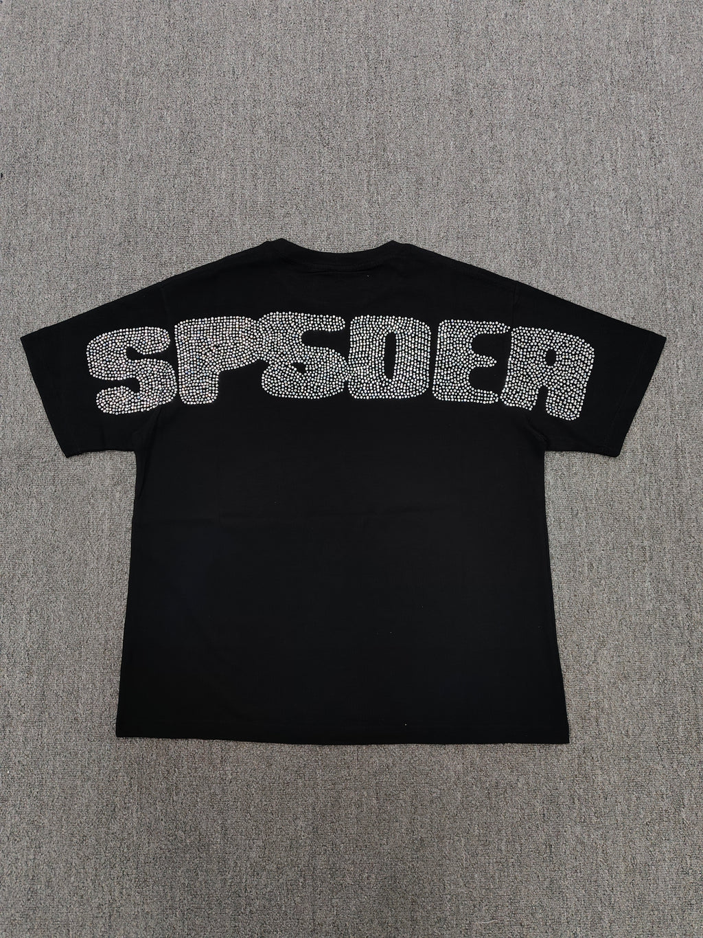 black Sp5der Rhinestone Silk Tee features a prominent crystal-embellished spider web graphic on the chest